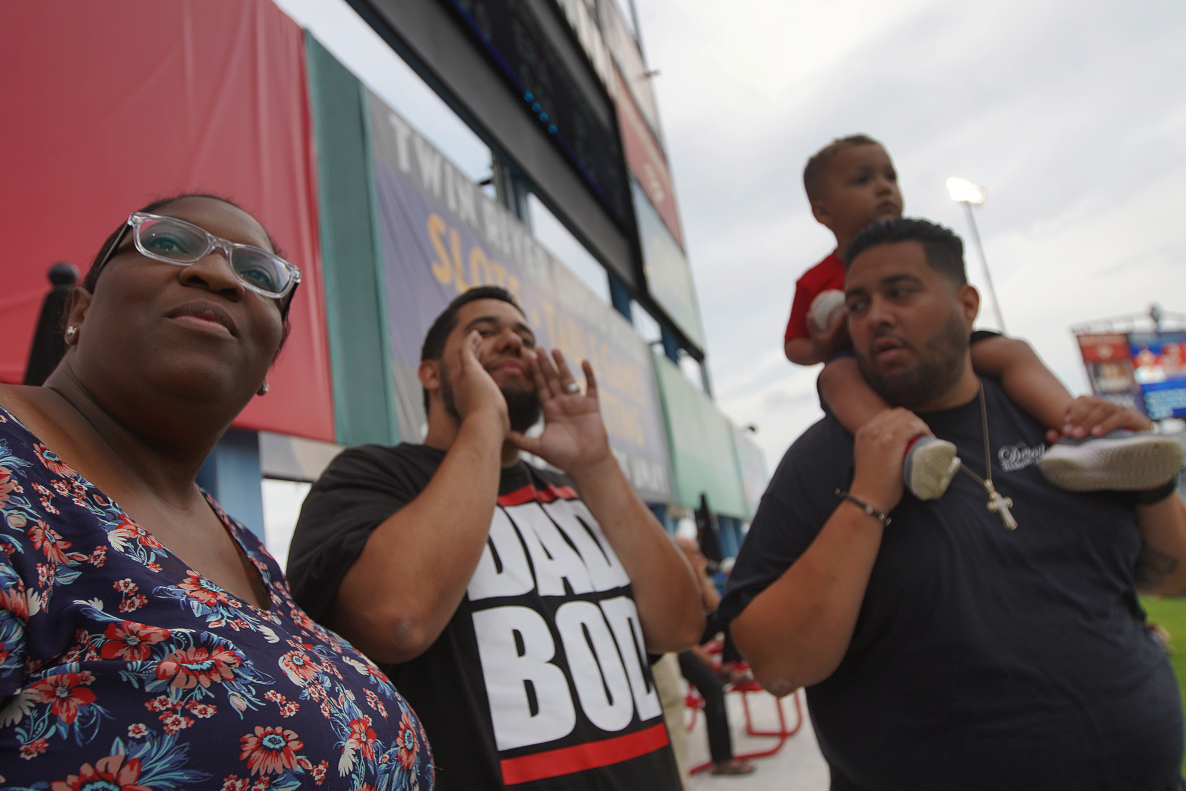 Mariah Barrett (left) of Providence, RI, Carlos Garcia (center) and brother Manny Garcia of Cranston with son Roman, 2.