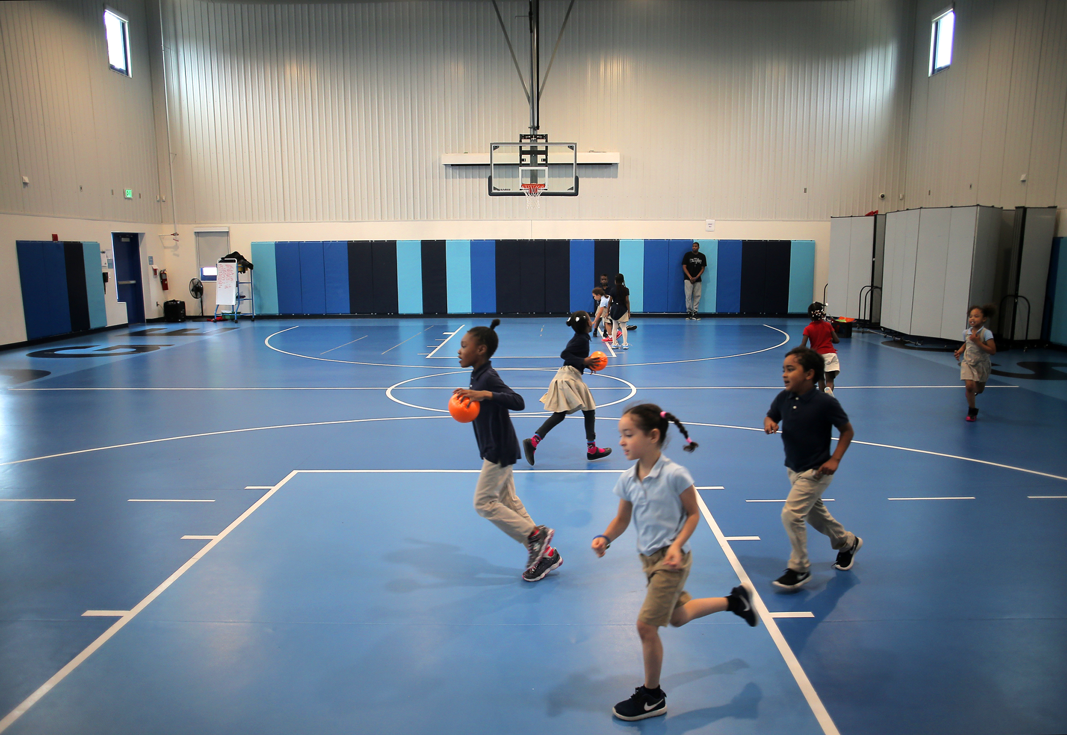 Students released some energy with a romp through a new gym, which Bridge Boston Charter School built at a converted office building.