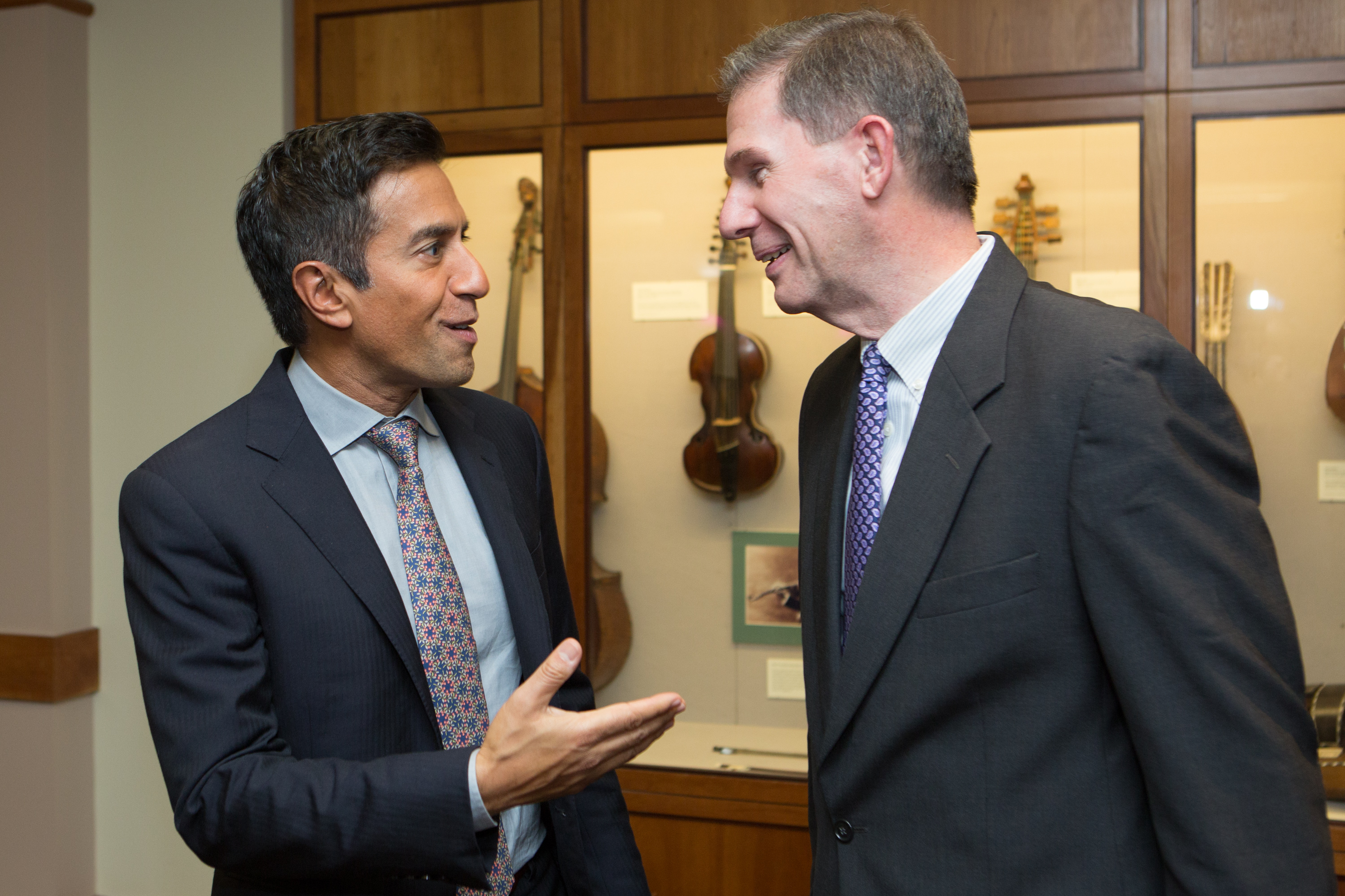 Sanjay Gupta (left) and Lesley University president Joseph Moore at Symphony Hall.
