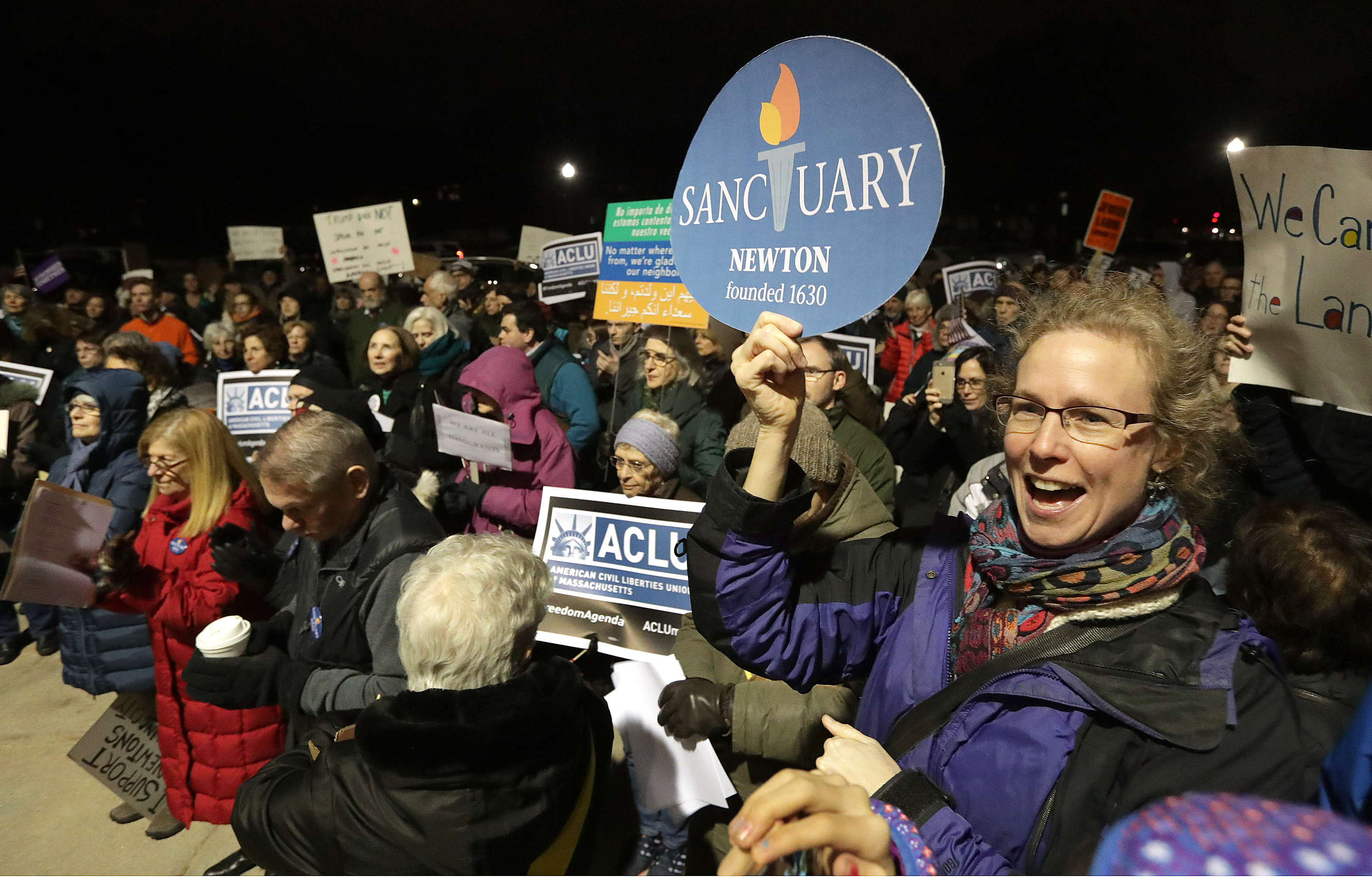 Julie Crosson joined the crowd at a rally outside of Newton City Hall Tuesday to urge the City Council to declare Newton a so-called welcoming city that strives to protect the rights of immigrants.