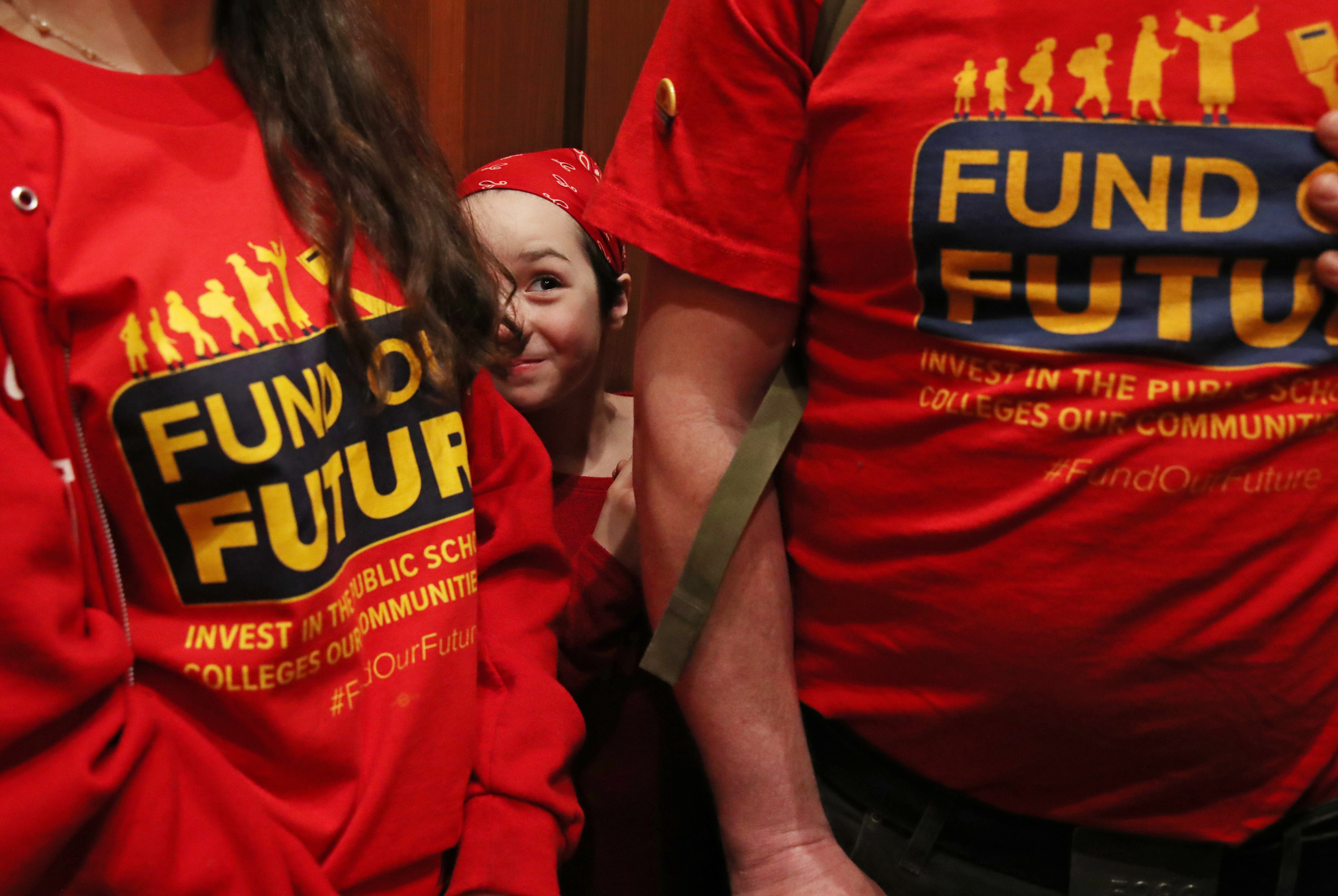 Maeve Stern, 9, of Westfield, peaked through her family while in an elevator at the Massachusetts State House.