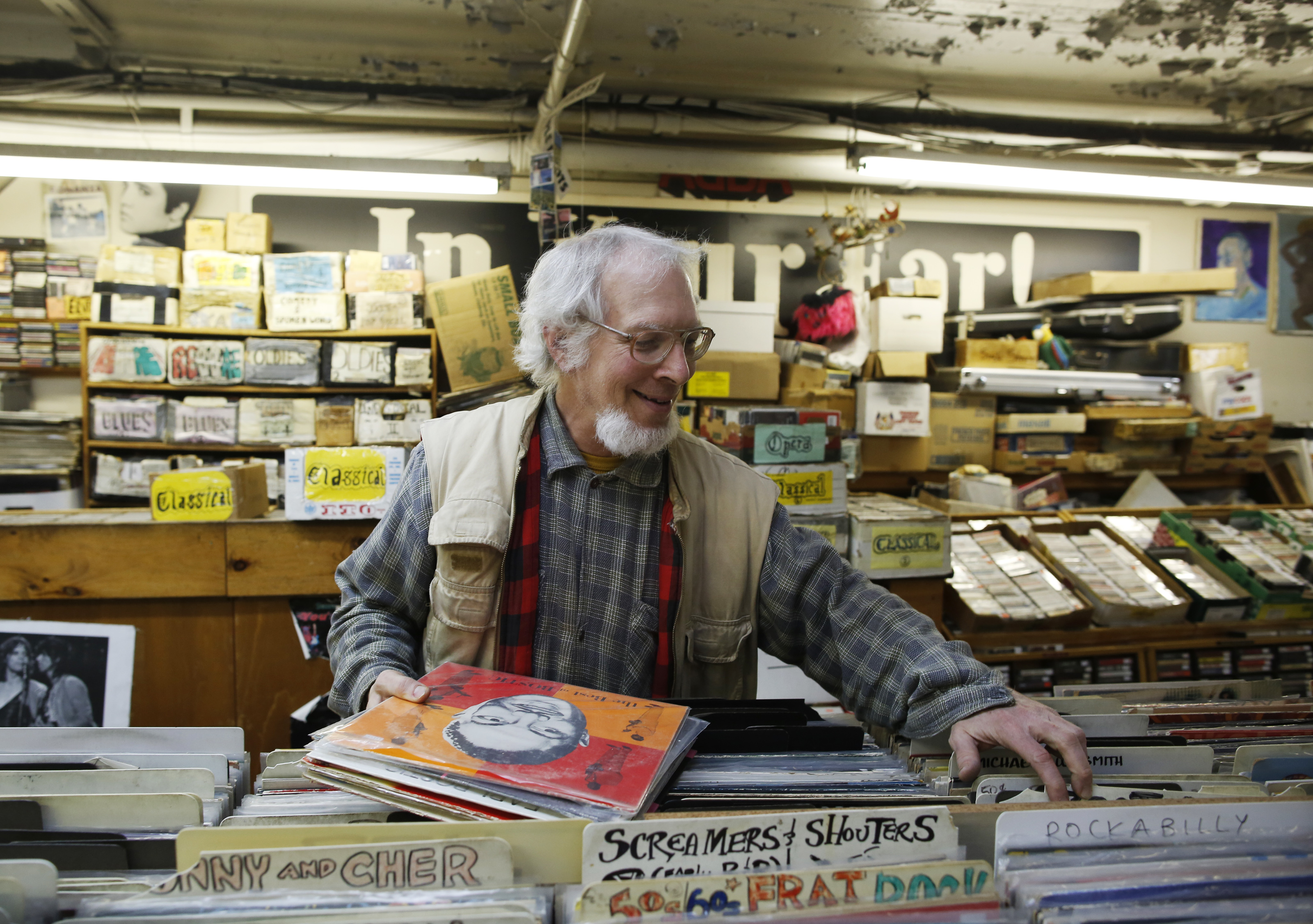 Co-owner of In Your Ear record store Reed Lappin inside his store in 2013.