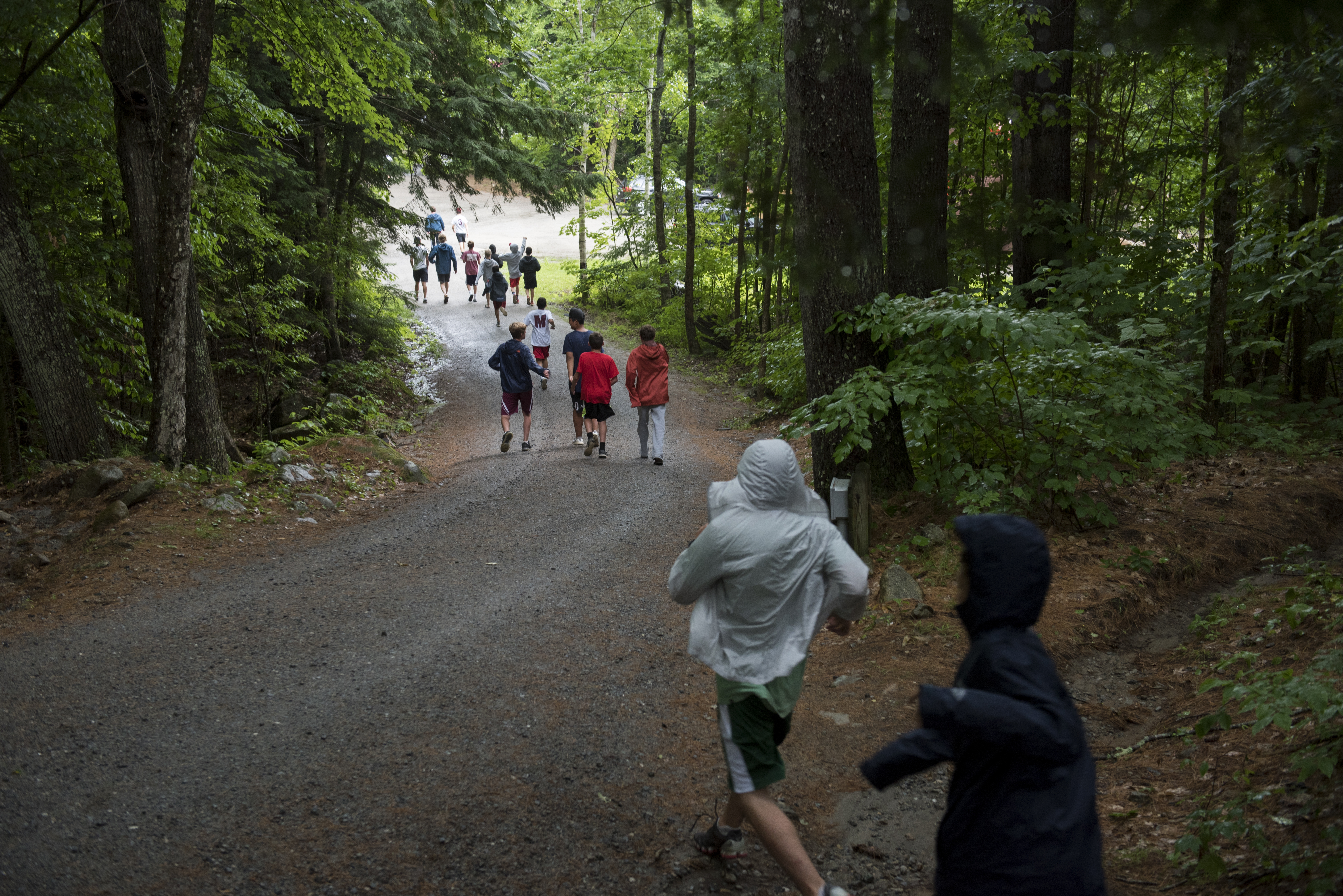 Campers headed down to dinner during a rainy afternoon at Camp Moosilauke.