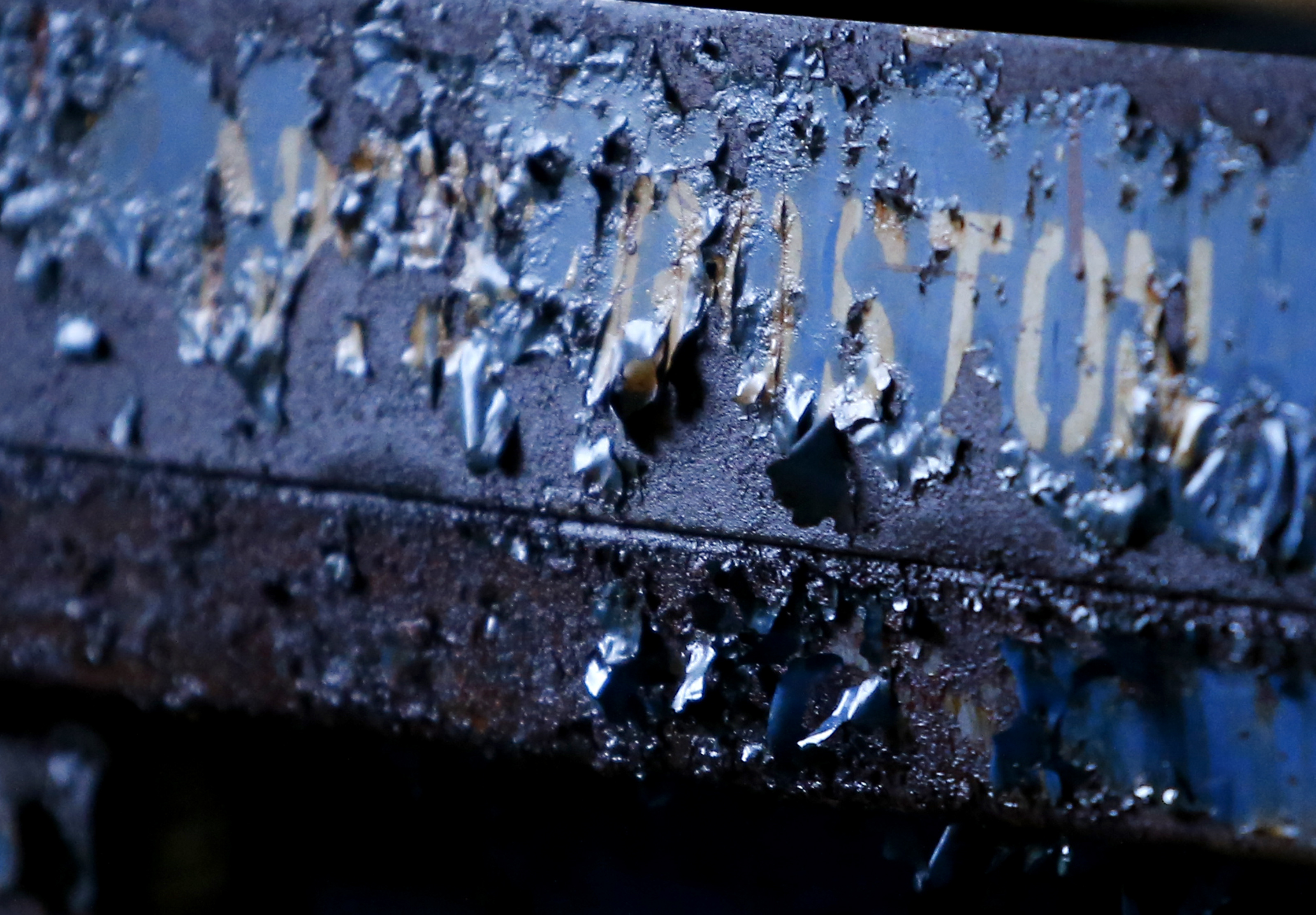 Paint peeled on the word “Boston” etched along the side of a scissor lift inside the power station.
