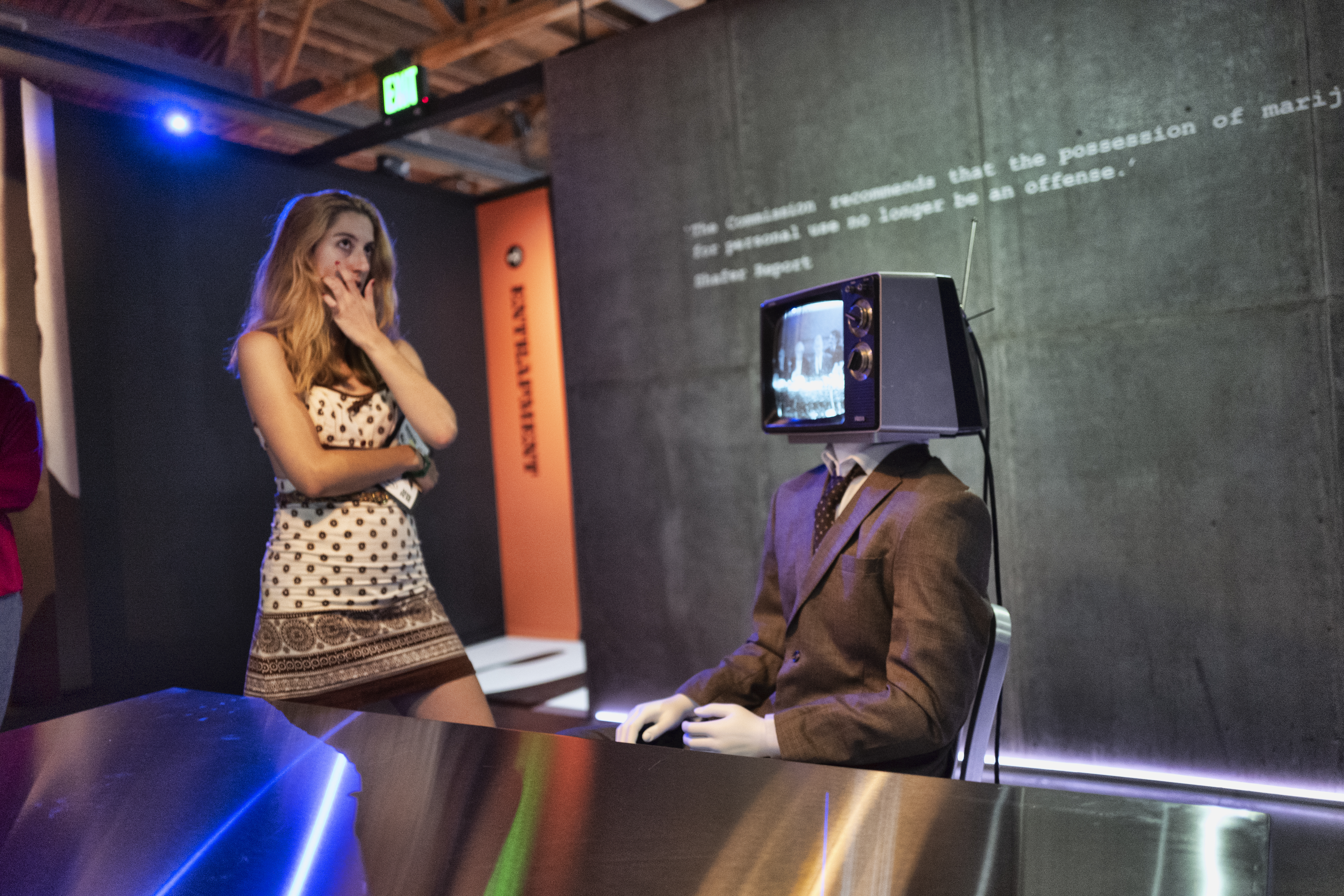 Maria Duke, associate producer on the project, passes through one of the interactive displays.