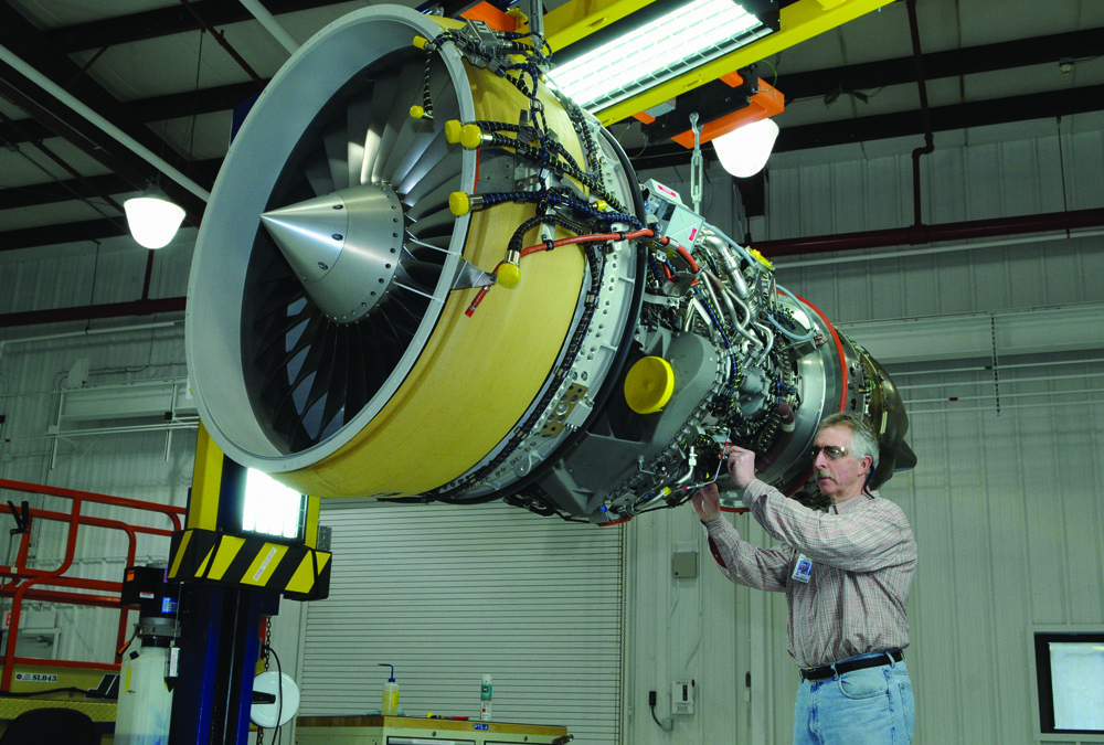 A CF34 engine is inspected for sign-off prior to customer shipment in the prep-to-ship area at the Lynn General Electic plant.