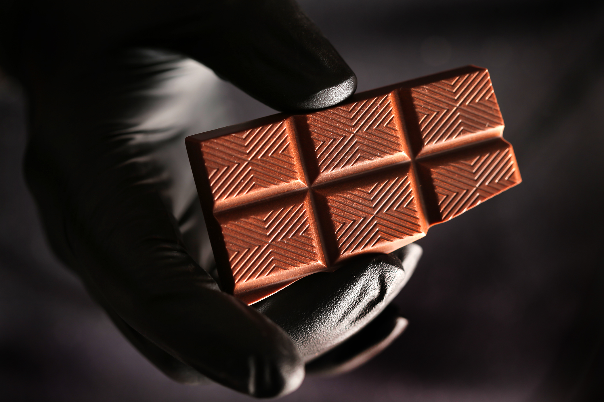 An anonymous artisan displayed a handmade blended block of milk and dark chocolate, infused with orange and cannabis.