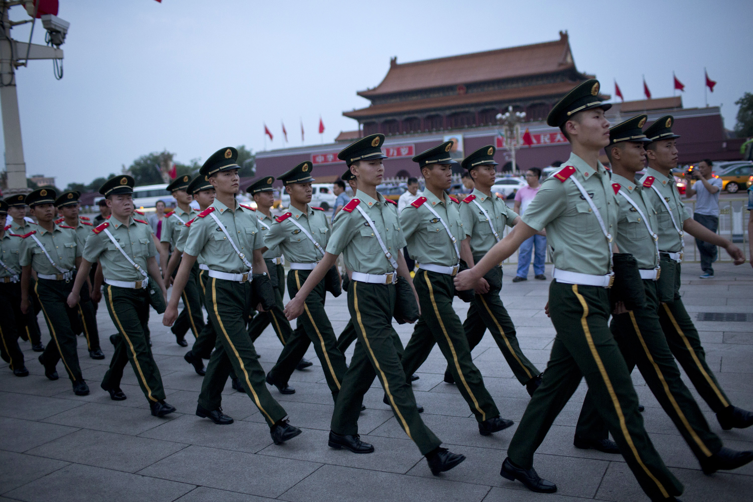 Paramilitary policemen marched on Tiananmen Square after a flag-lowering ceremony on Wednesday.
