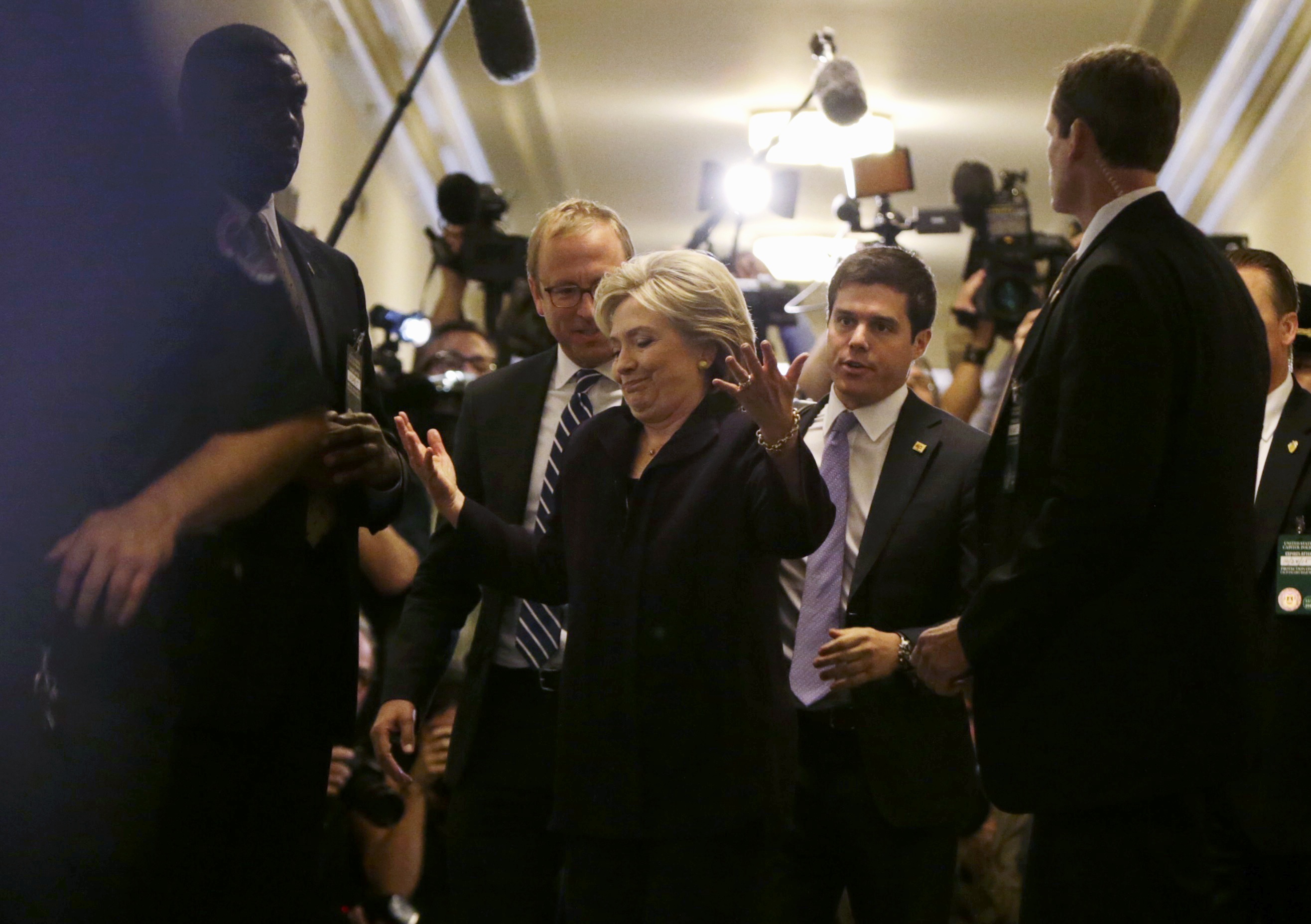 Former secretary of state Hillary Clinton reacted to reporters’ questions as she left the hearing room for a lunch break Thursday on Capitol Hill.