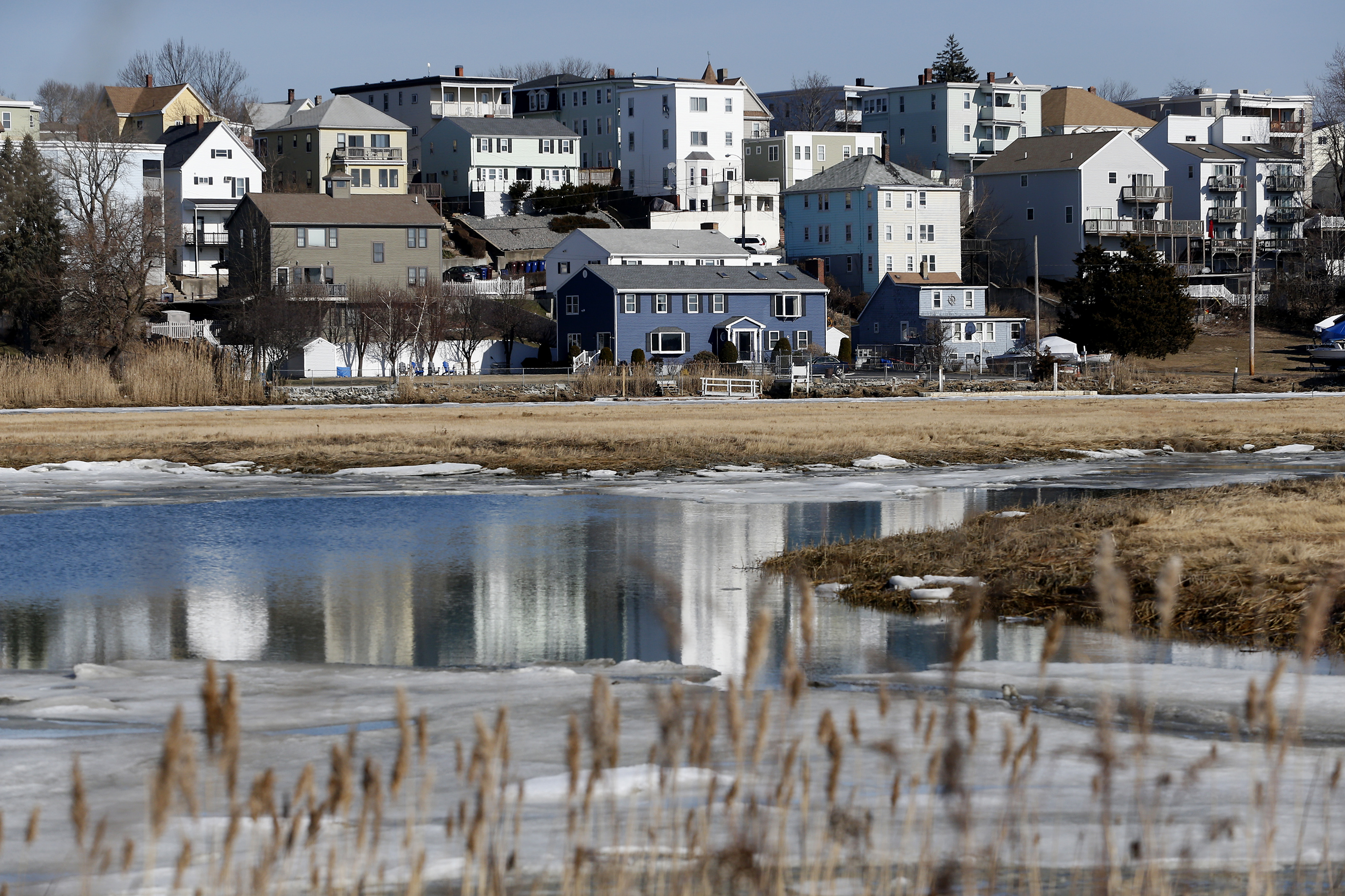 Houses are seen from Belle Isle Marsh.