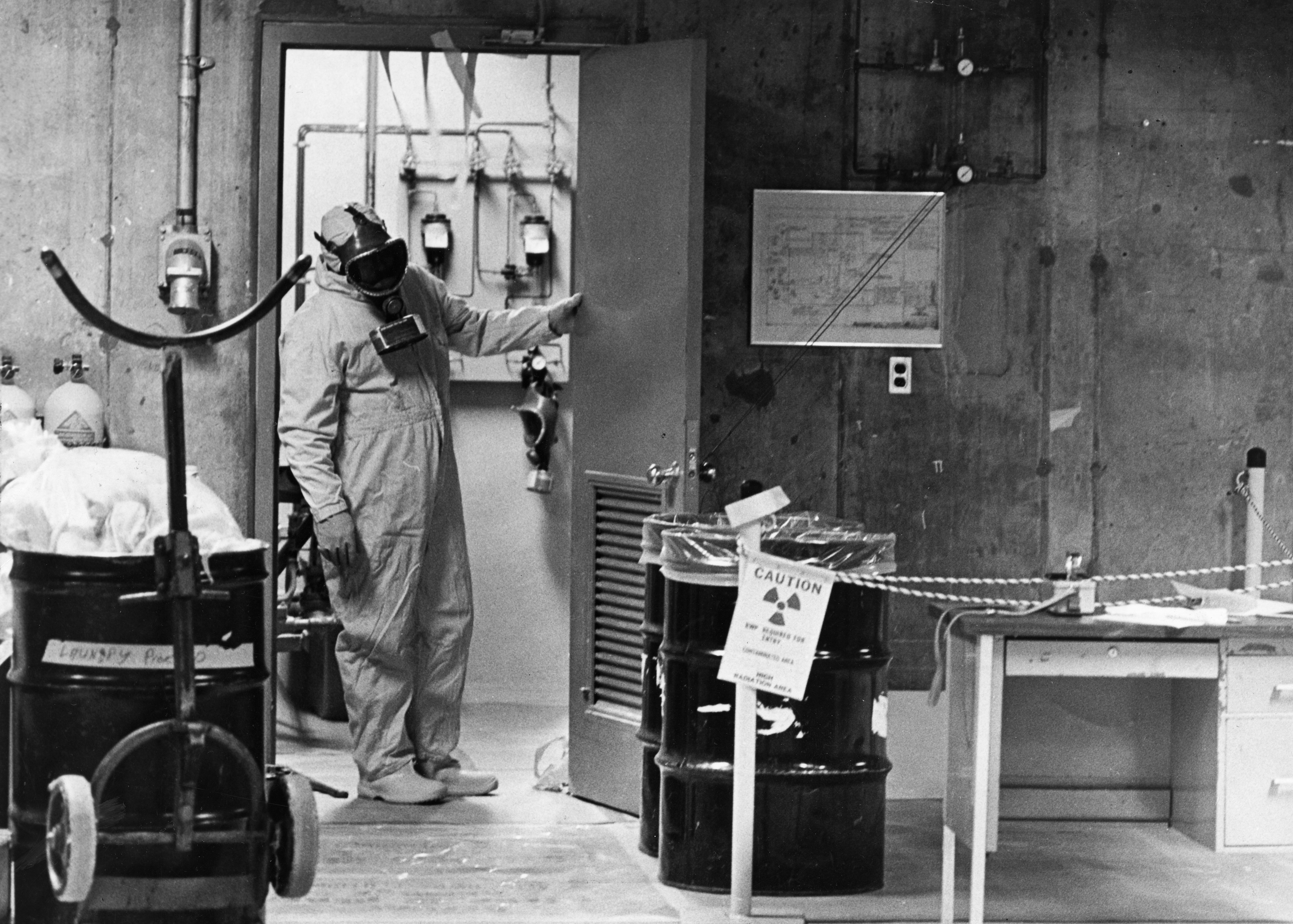 A Pilgrim plant employee wears protective garb to work in a radiation area in 1975.