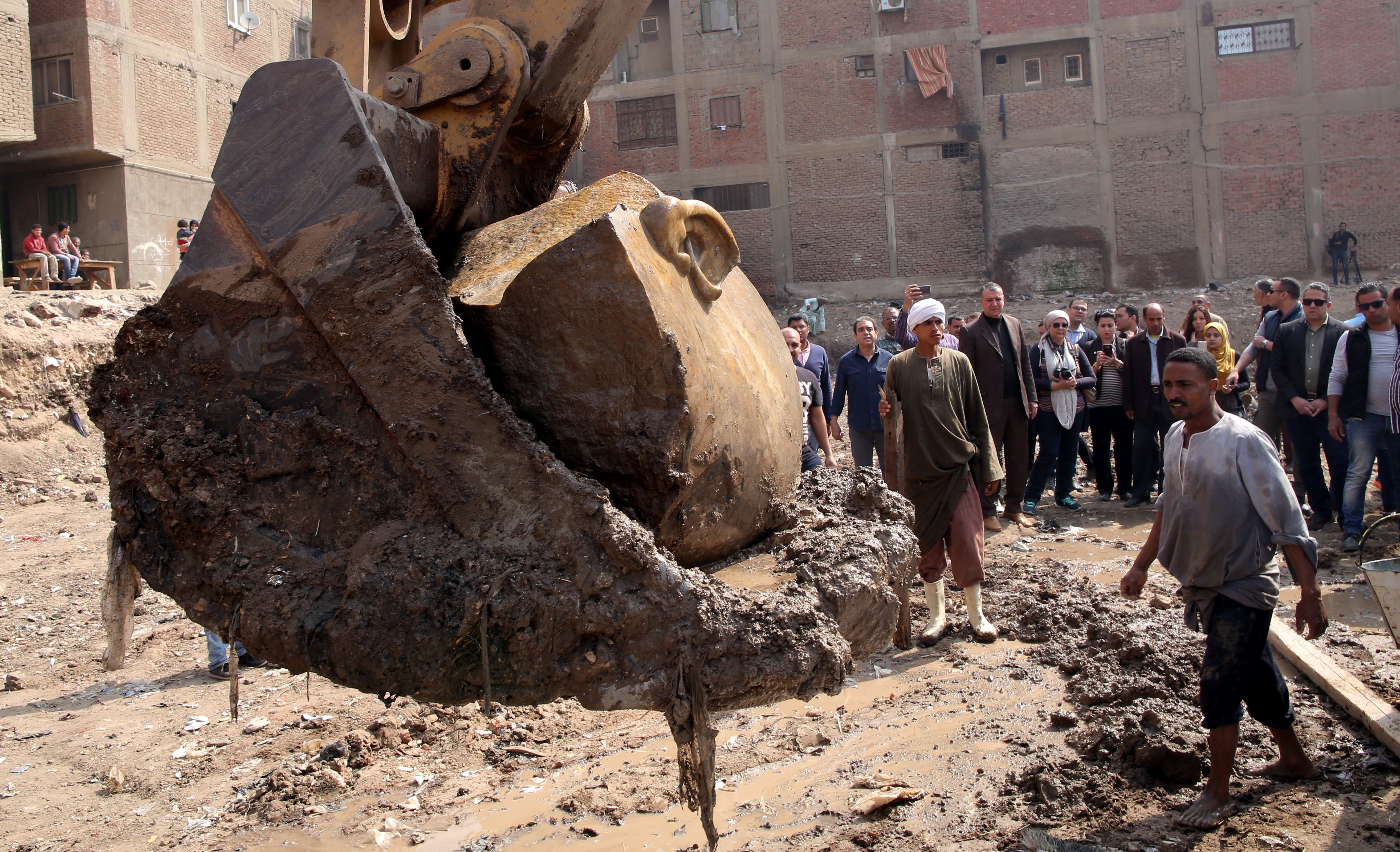 An excavator lifted part of the statue from the spot where it was unearthed.