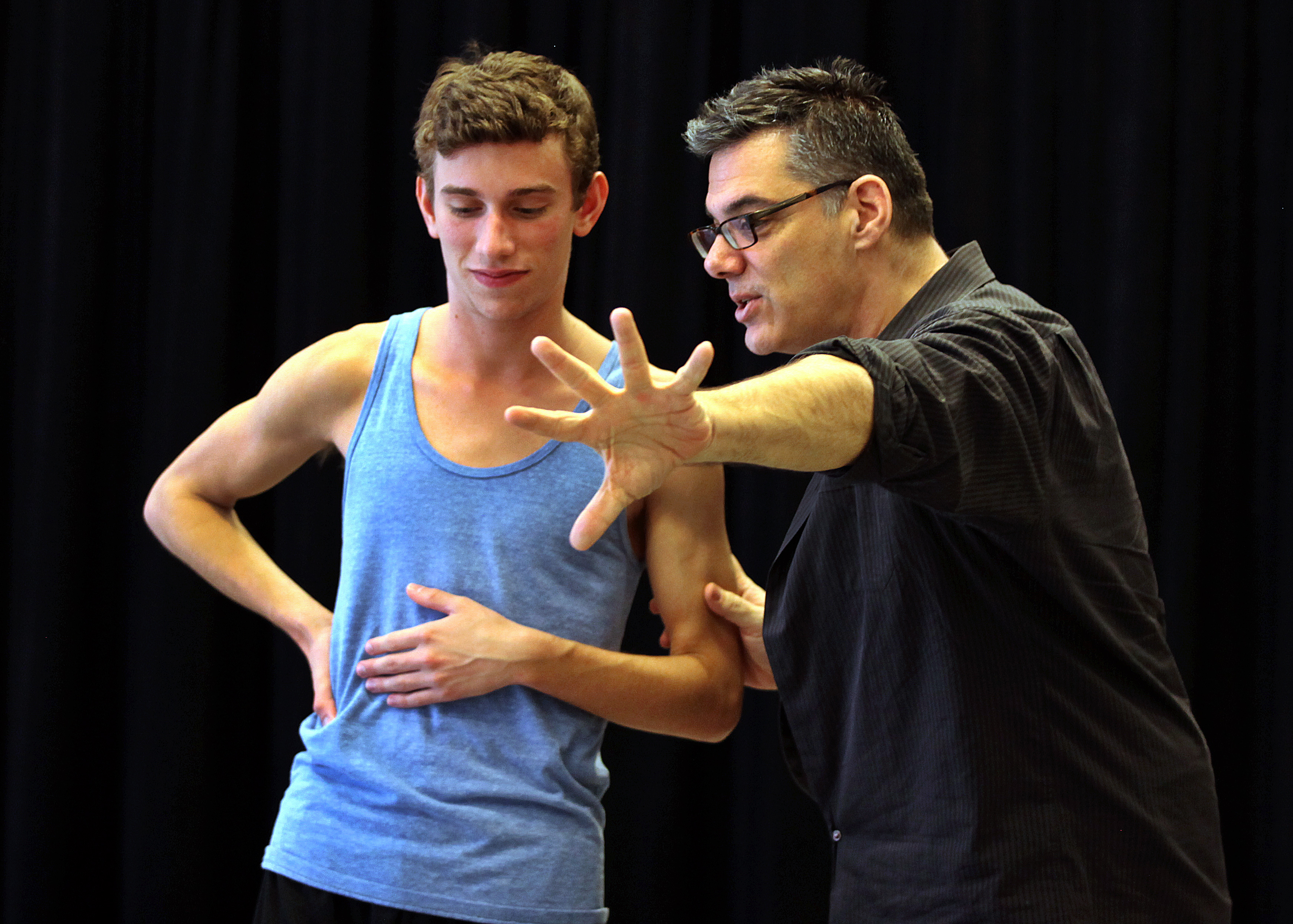 Boston, MA 3/30/13 Peter DiMuro, right, gives a pointer Andy Garcia while he rehearses his "Archives and Etchings" piece, inspired by Alzheimer's caregivers - with Boston Conservatory students. It's premiere will be in April at the Conservatory. DiMuro is the focus of the story. (Michele McDonald for the Boston Globe)