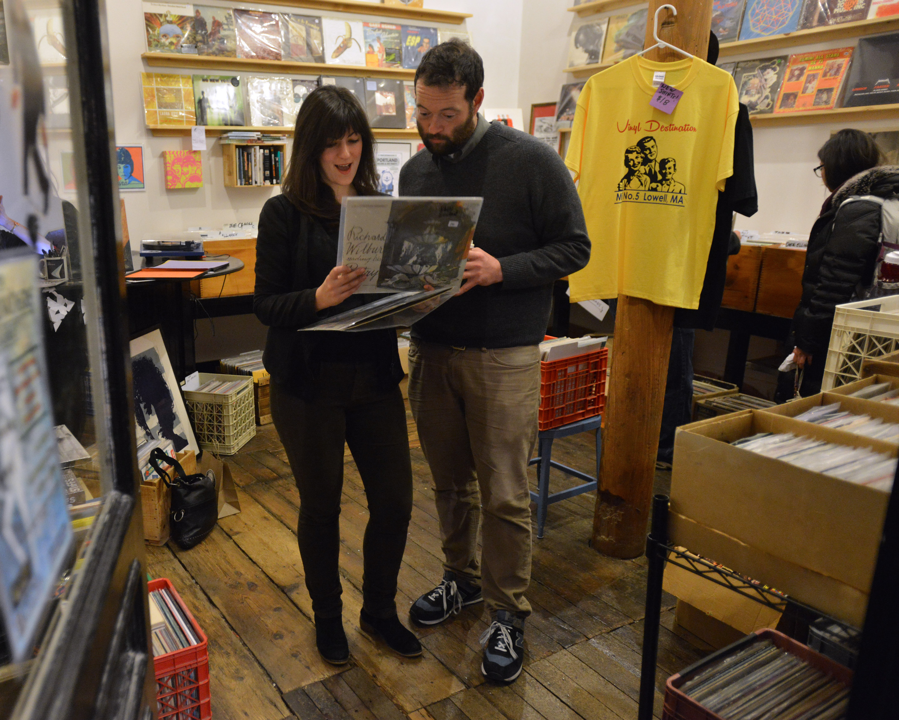 From left, Diana Collins of Cambridge, and friend Phil Martin of Medford shop for records at Vinyl Destination in Mill No. 5.