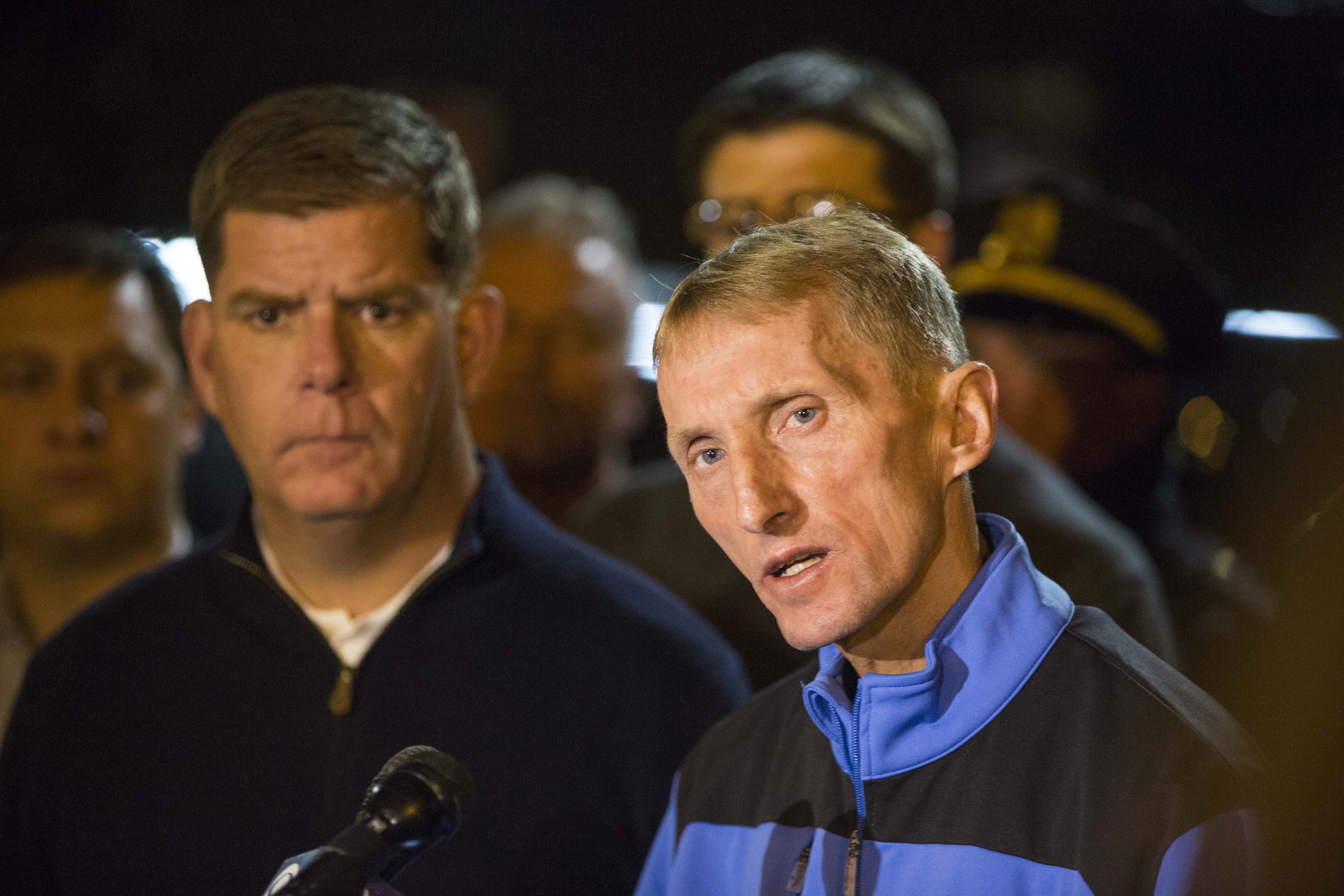 Boston Police Commissioner William Evans (right) delivered a statement outside of Massachusetts General Hospital, where two officers were brought after being critically wounded in a shooting Wednesday night.