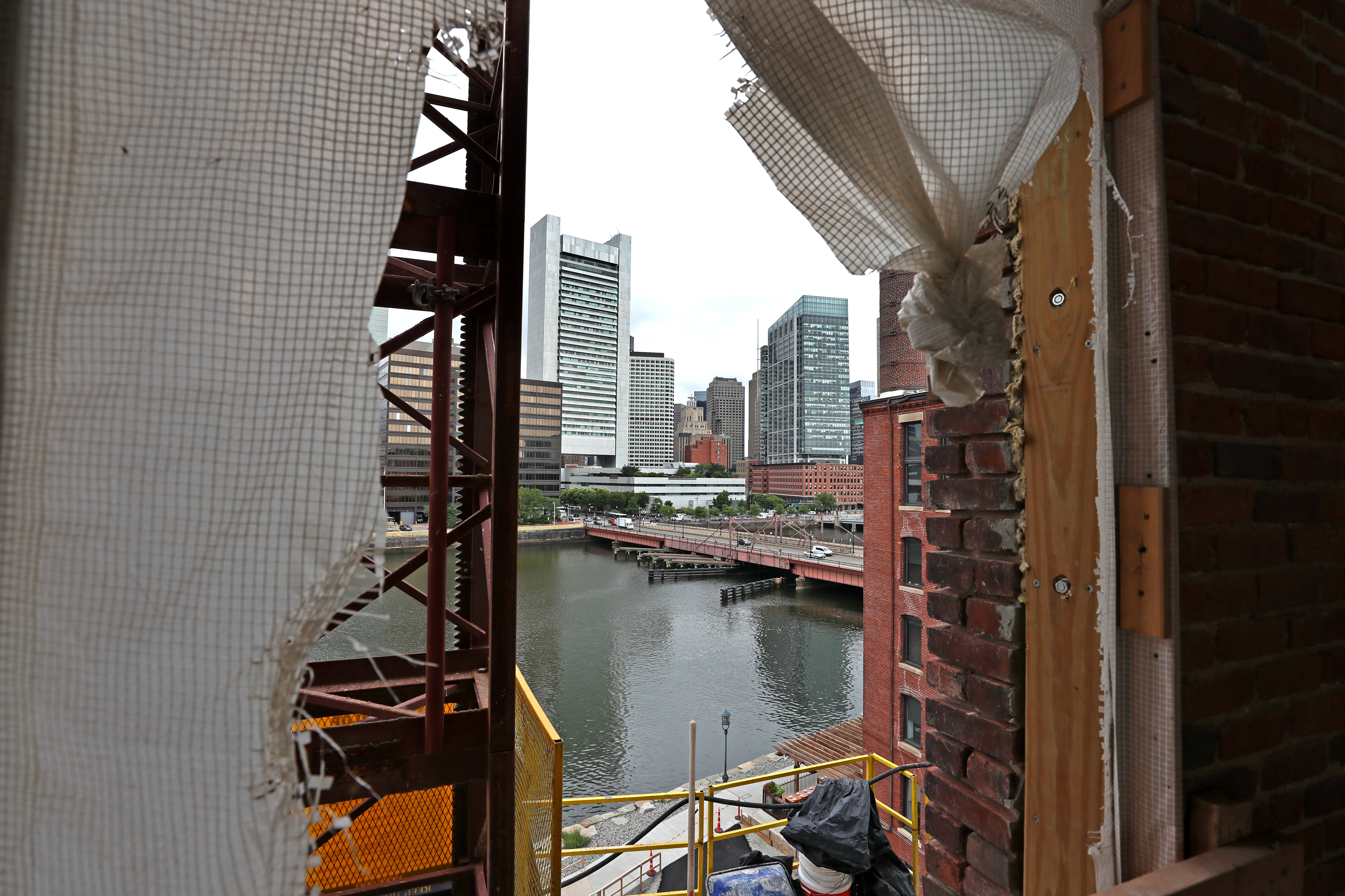 A view from one of the upper floor levels with Fort Point Channel and Boston in the background at the new General Electric HQ on Necco Court Boston under construction.