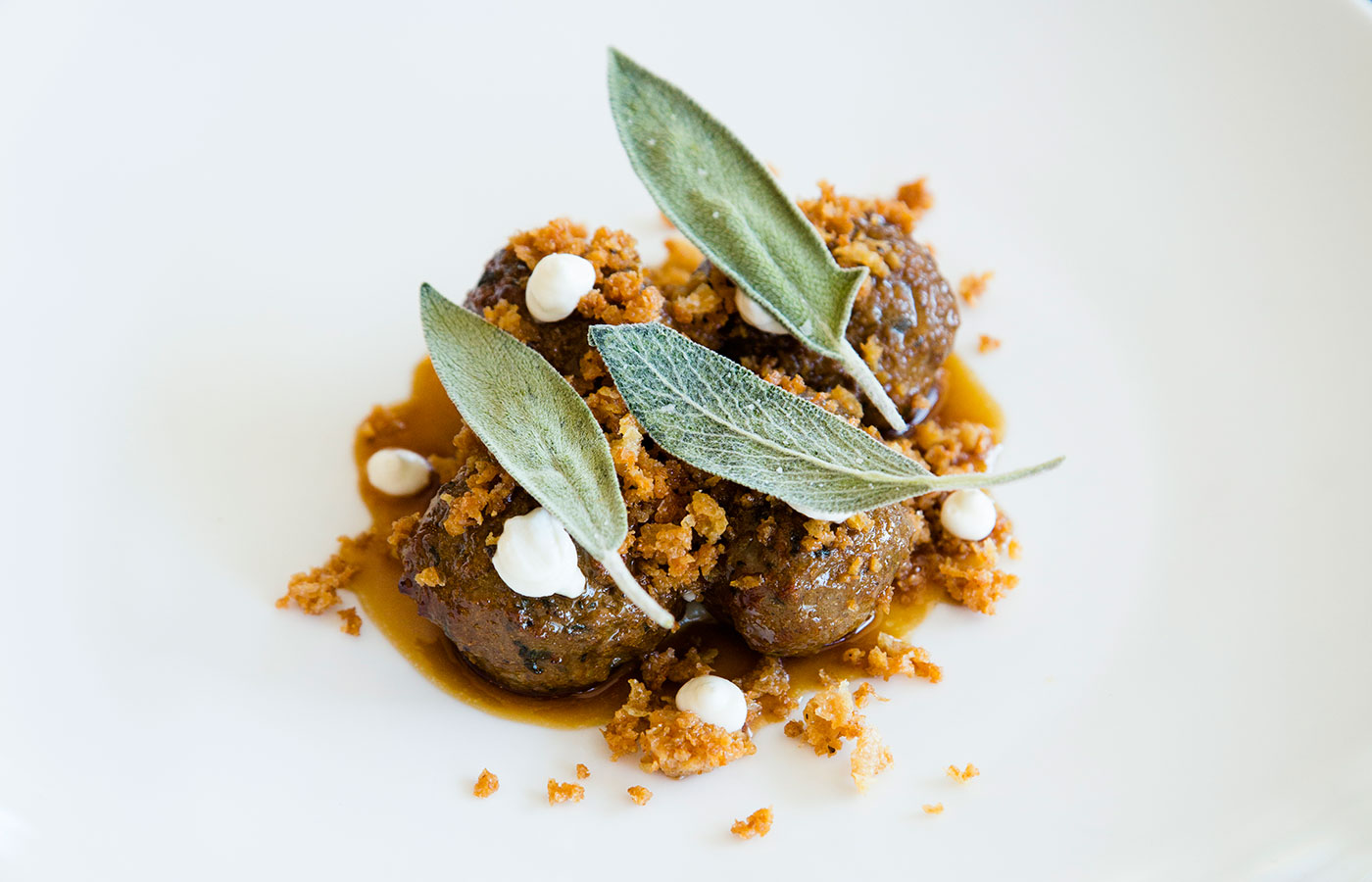 A current Speidel creation at Persimmon, lamb polpette with parsnip puree and yogurt.