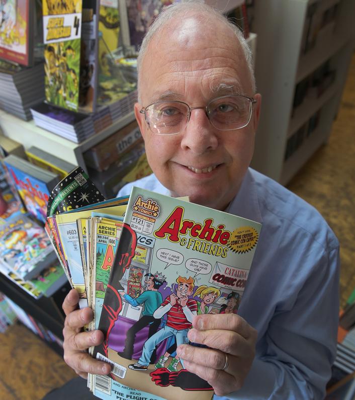 Filmmaker Gerald Peary with some Archie comic books.