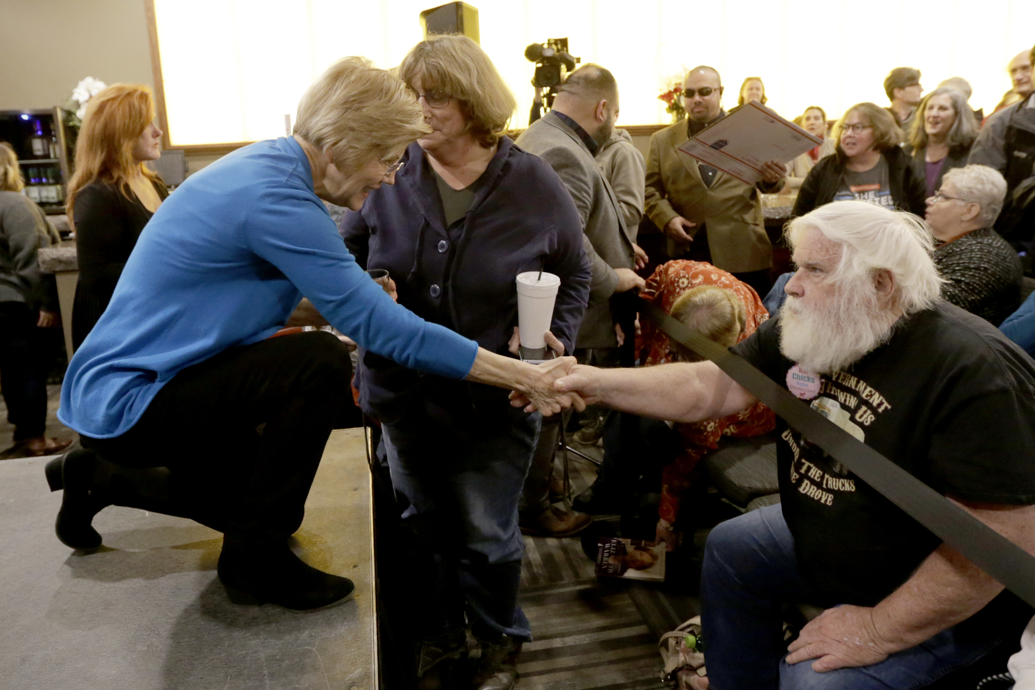 Warren shook hands with a supporter following the event.