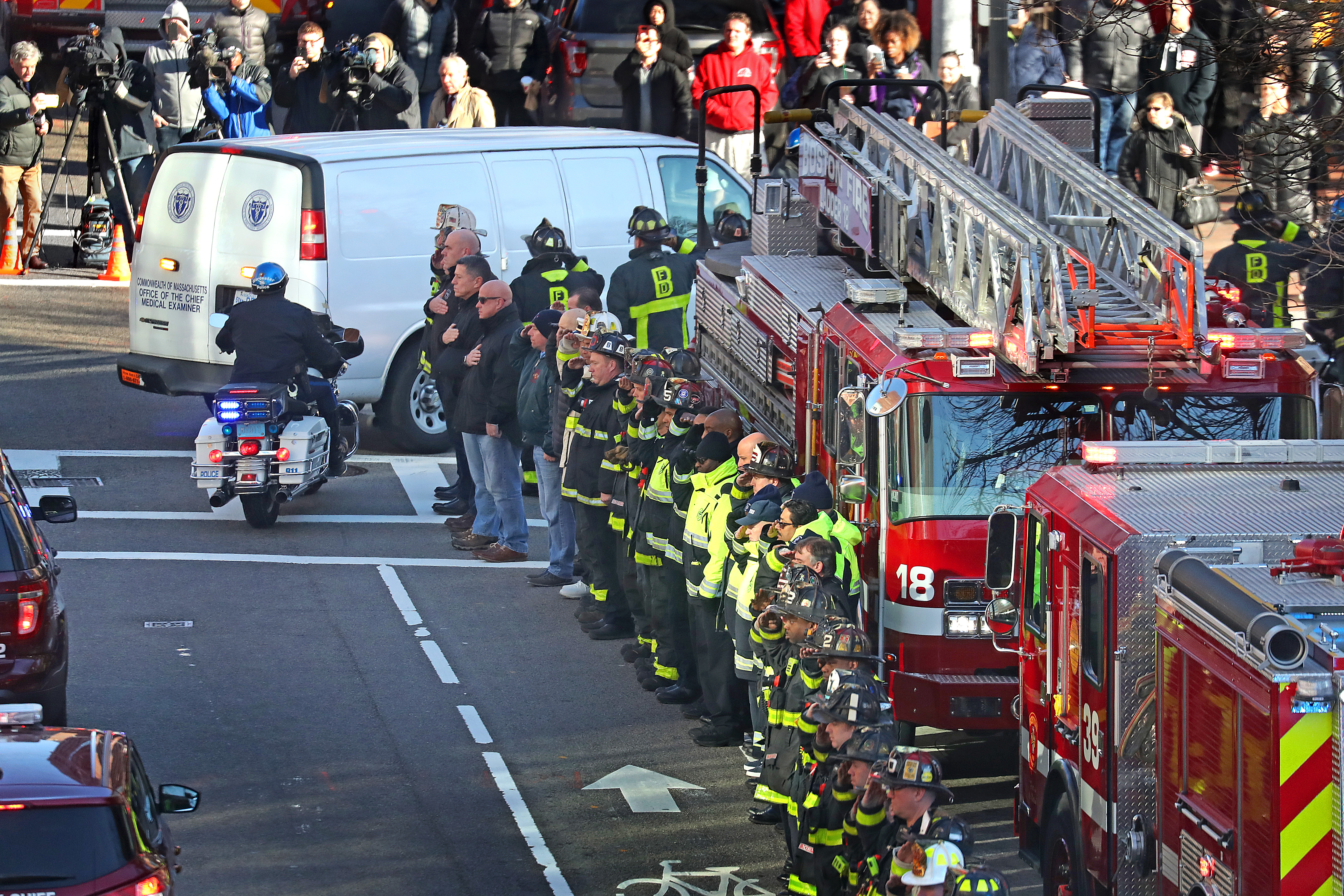Boston firefighters and police officers gathered outside the medical examiner’s office to pay tribute.