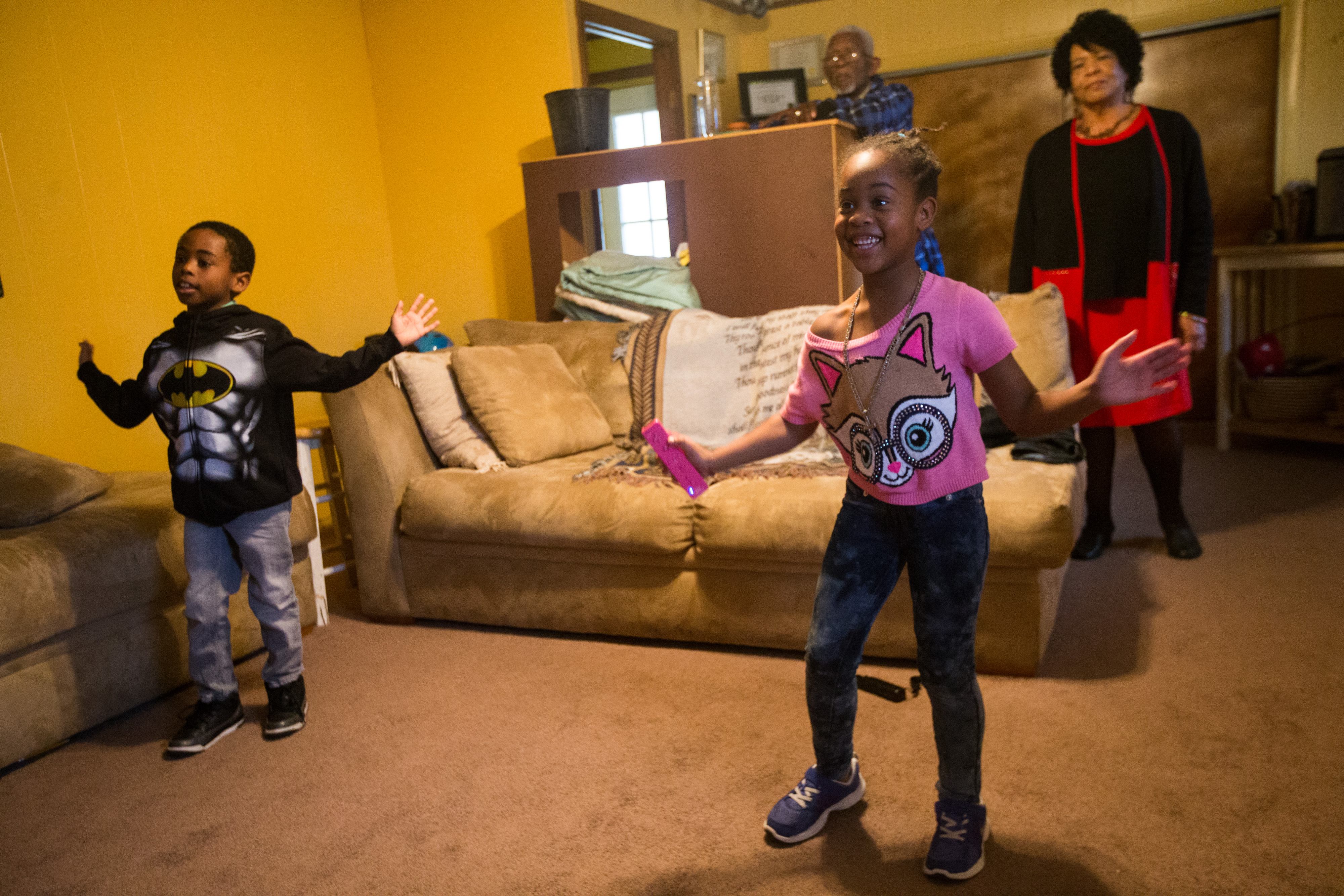 Gloria Harris-Gilmore and her husband John H. Gilmore watched as their grandchildren Ajhier Gilmore and Deja Tench played in their home in Brockton.