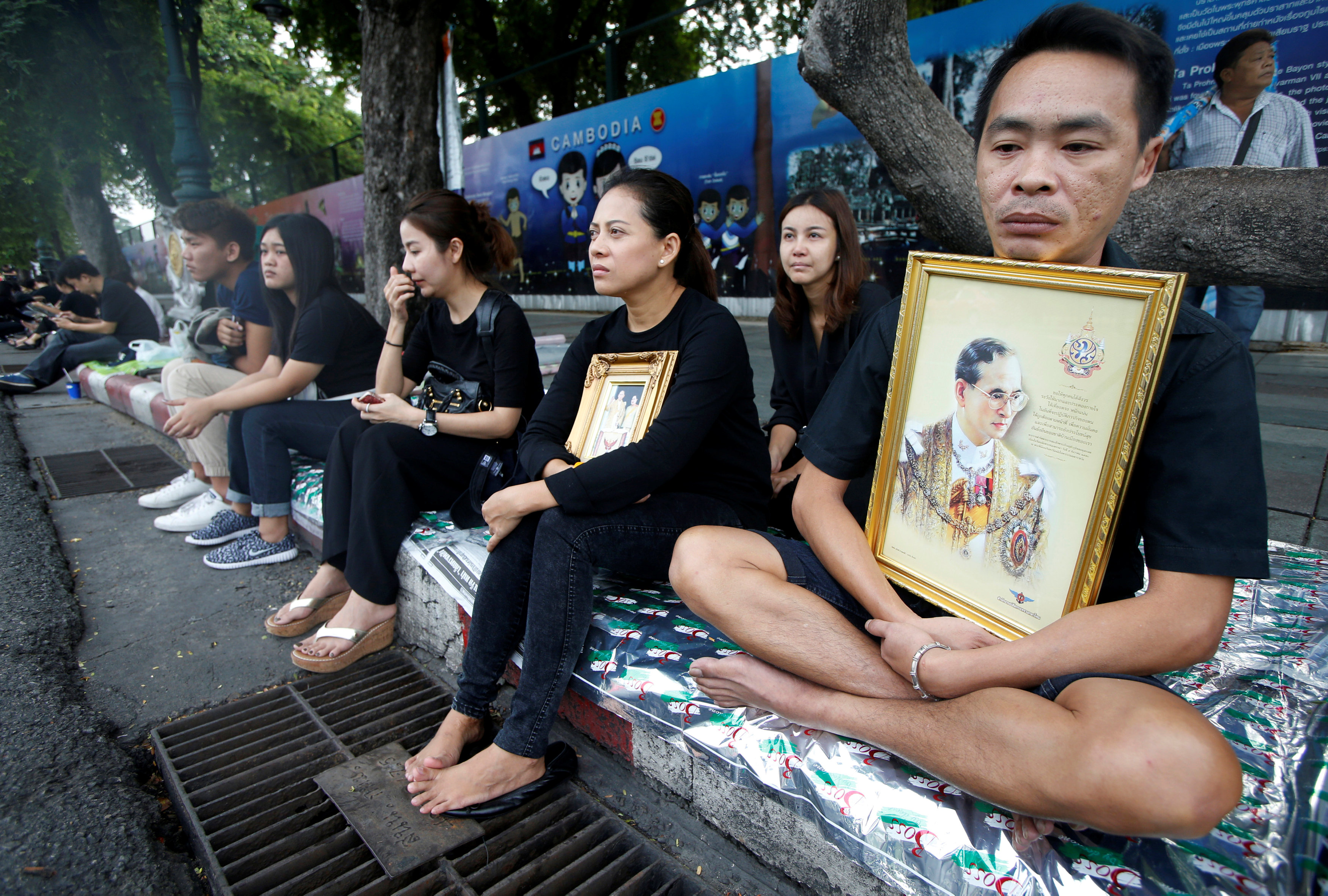 People mourning the late king waited along a procession route near the Grand Palace in Bangkok, Thailand, on Thursday.