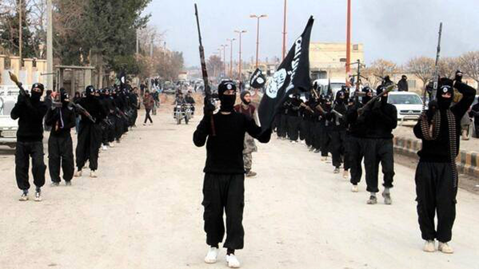 An undated image posted on a militant website on Jan. 14, purporting to show ISIS fighters marching in Raqqa, Syria.