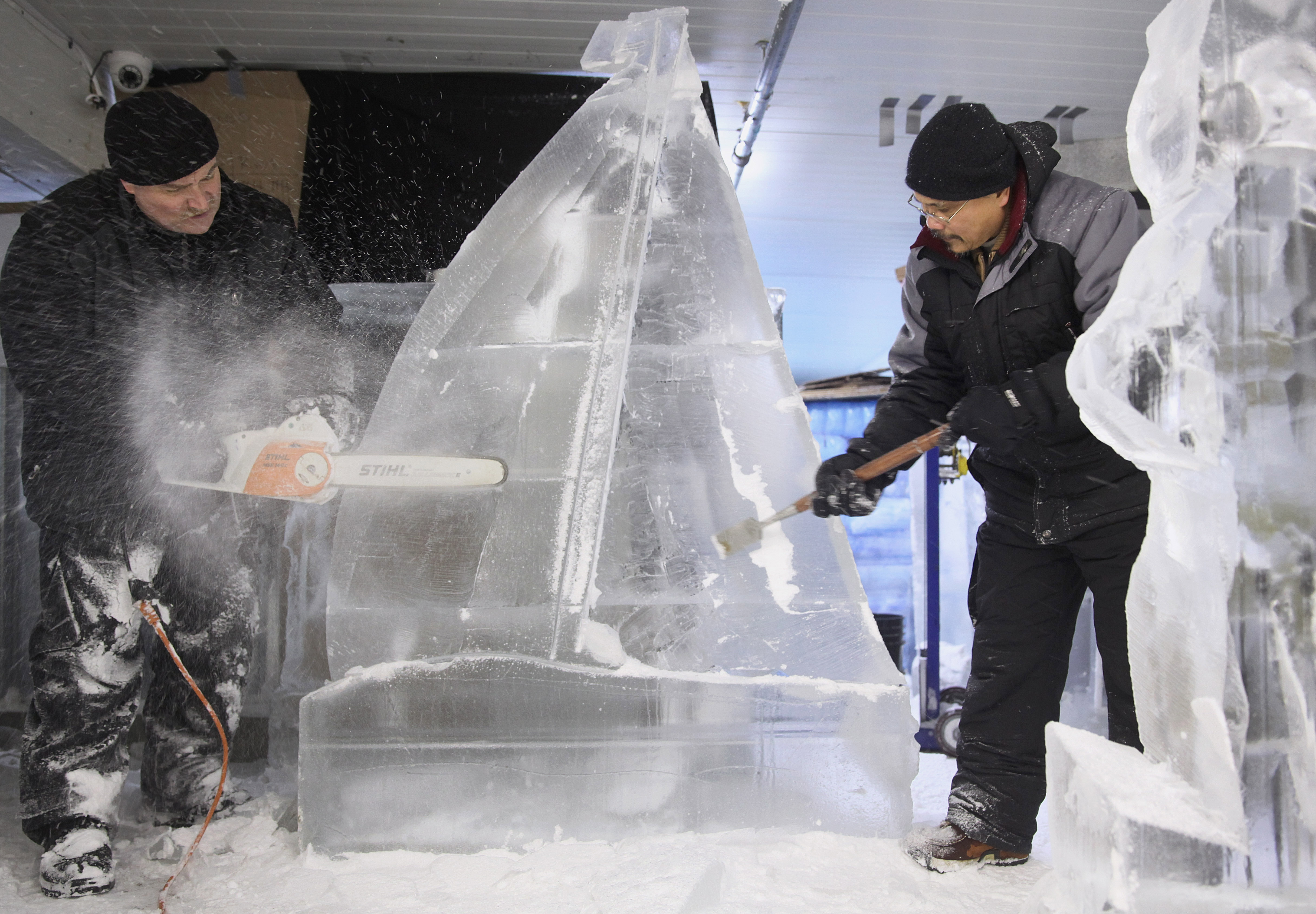 Eric Fontecchio and assistant Rosendo Manacop were putting the finishing touches on a sailboat on Christmas Eve.