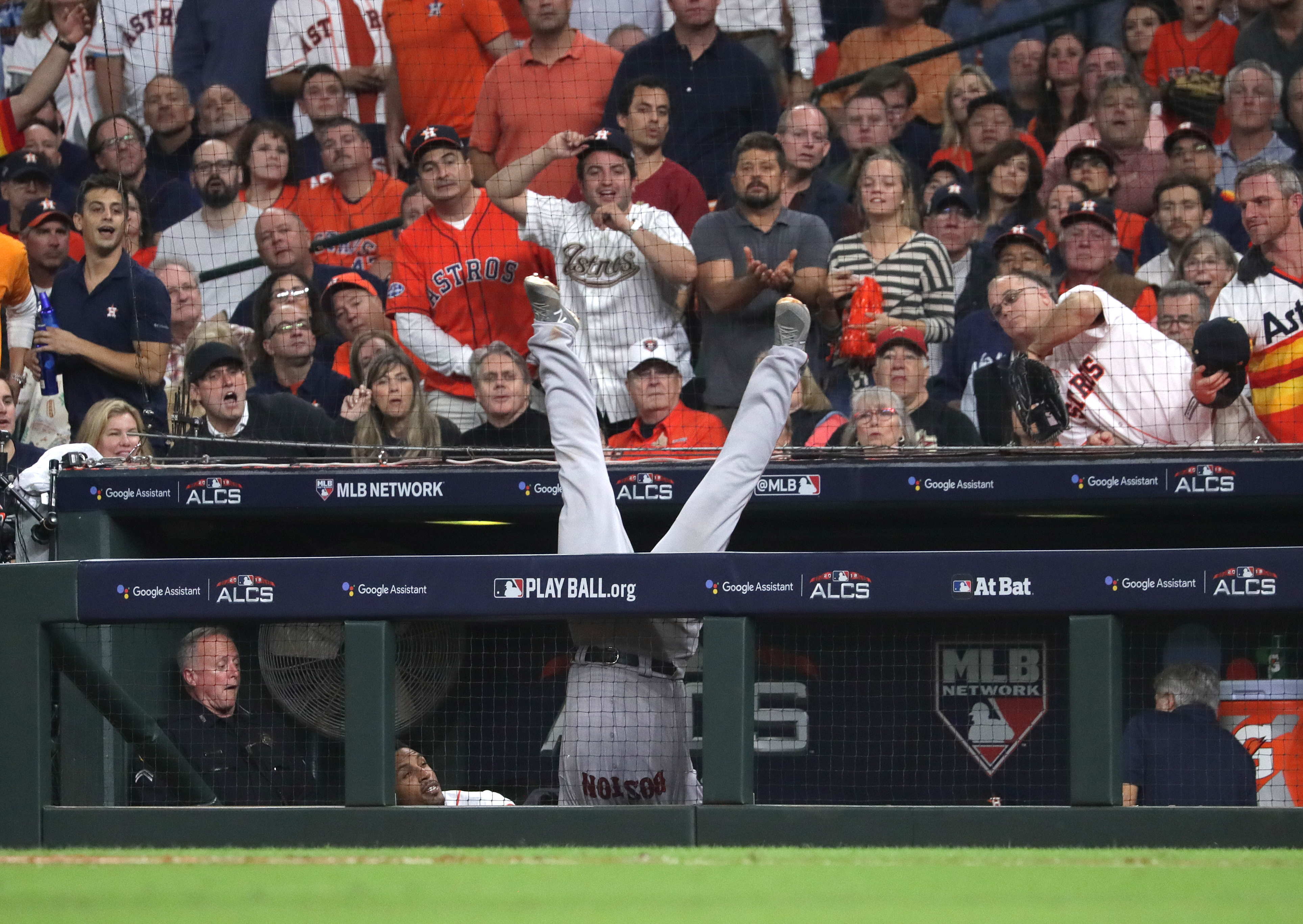 Steve Pearce goes over the fence in front of Astros dugout.