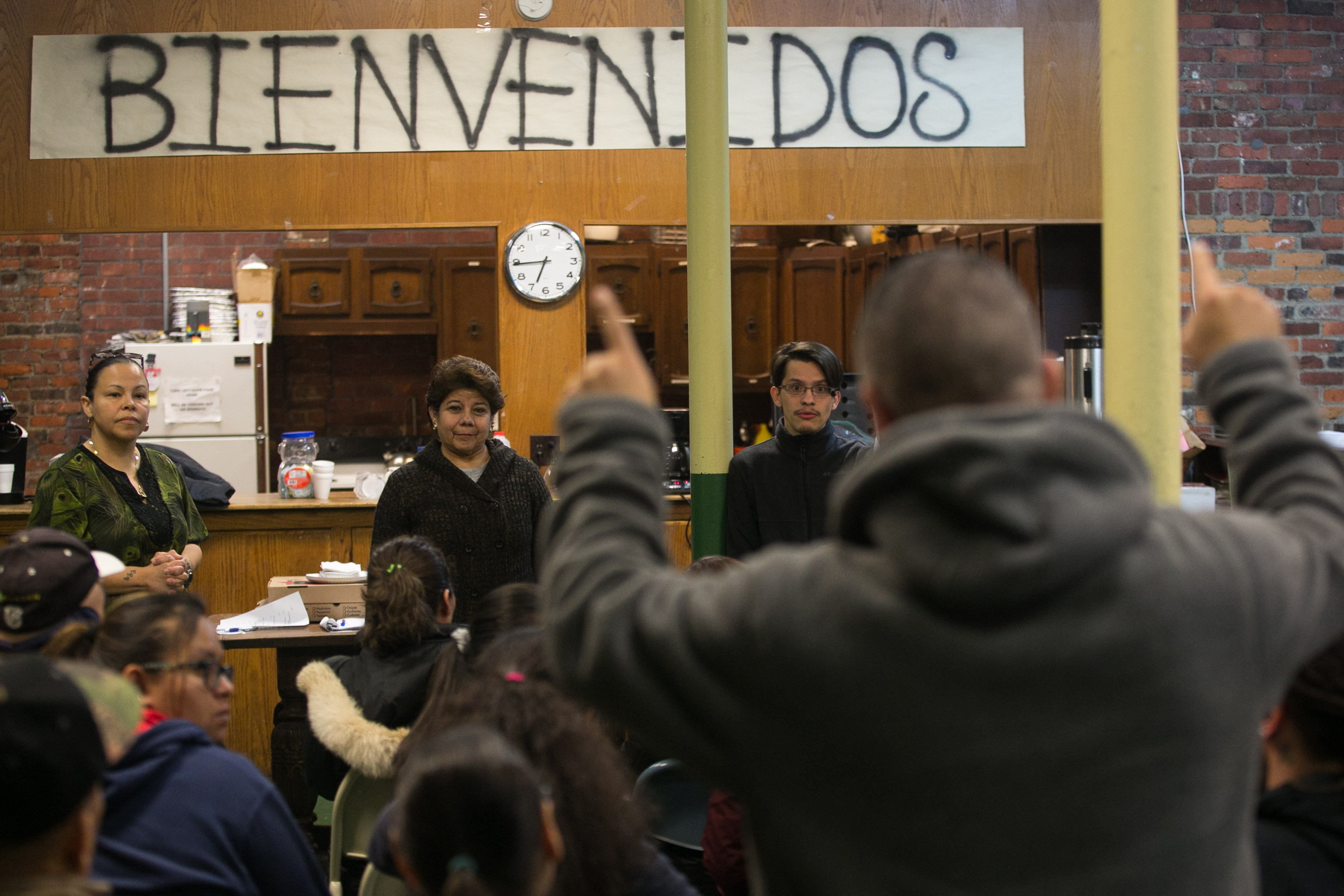 Members of the community group City Life/Vida Urbana (from left) Annette Diaz, Olga Pasco, and Andres Del Castillo listened earlier this month as Carlos Enao told about being evicted from his home in East Boston after the building was sold.