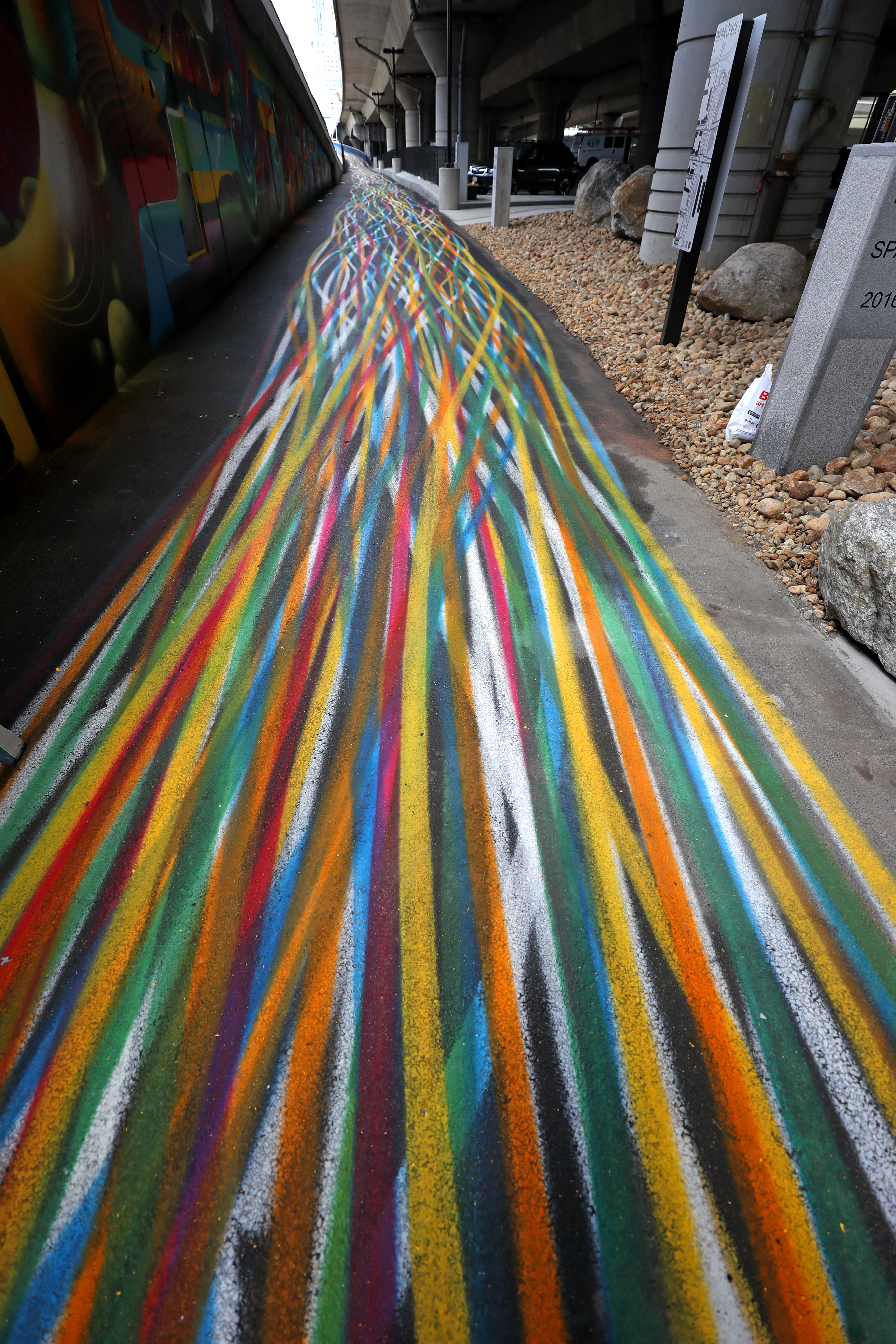 The artwork at the new park called Ink Underground utilizes the landscape that resulted from Interstate 93.