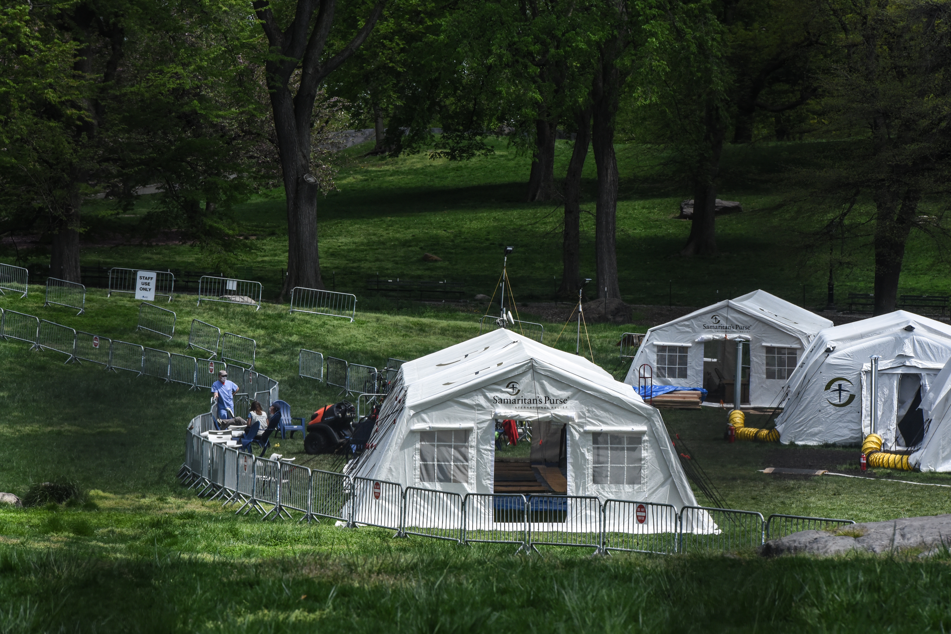The white tents of the Samaritan's Purse field hospital stand in a field in Central Park across the street from Mt. Sinai Hospital on the Upper East Side neighborhood in New York City. Mt. Sinai reports that the surge in COVID-19 hospital admissions is reaching manageable levels; therefore, Mt. Sinai will stop admitting new patients to the Central Park field hospital run by Samaritan's Purse as of May 4.