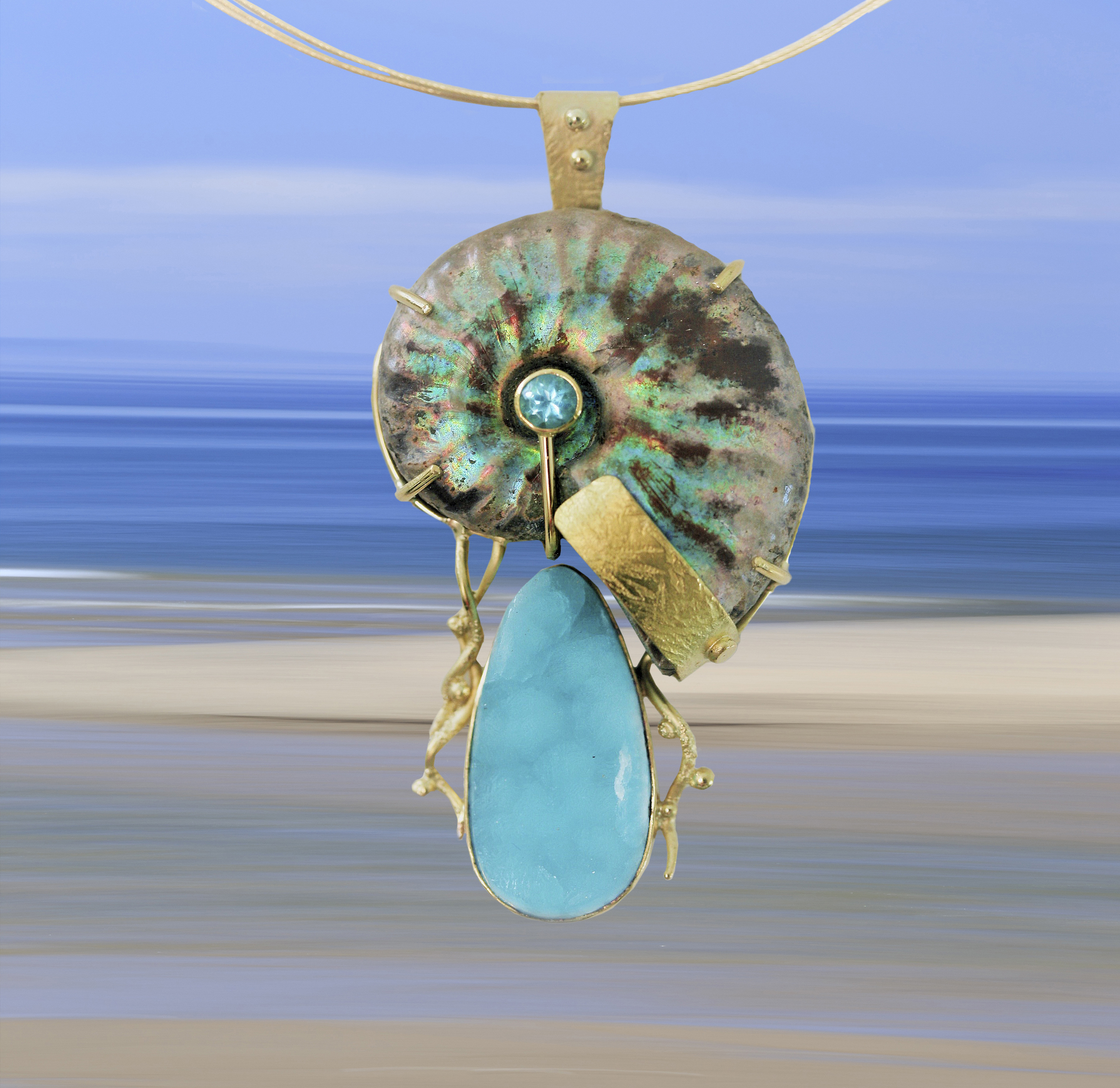 Works by more than 175 artists will be on display at the Paradise City Arts Festival in Marlborough March 20-22, including “Ocean View” (pictured here), captured by E. Kelly O'Neal's abstracted photograph of the Cape Cod shoreline. Steven Kolodny's "Nautilus" pendant is suspended before it.