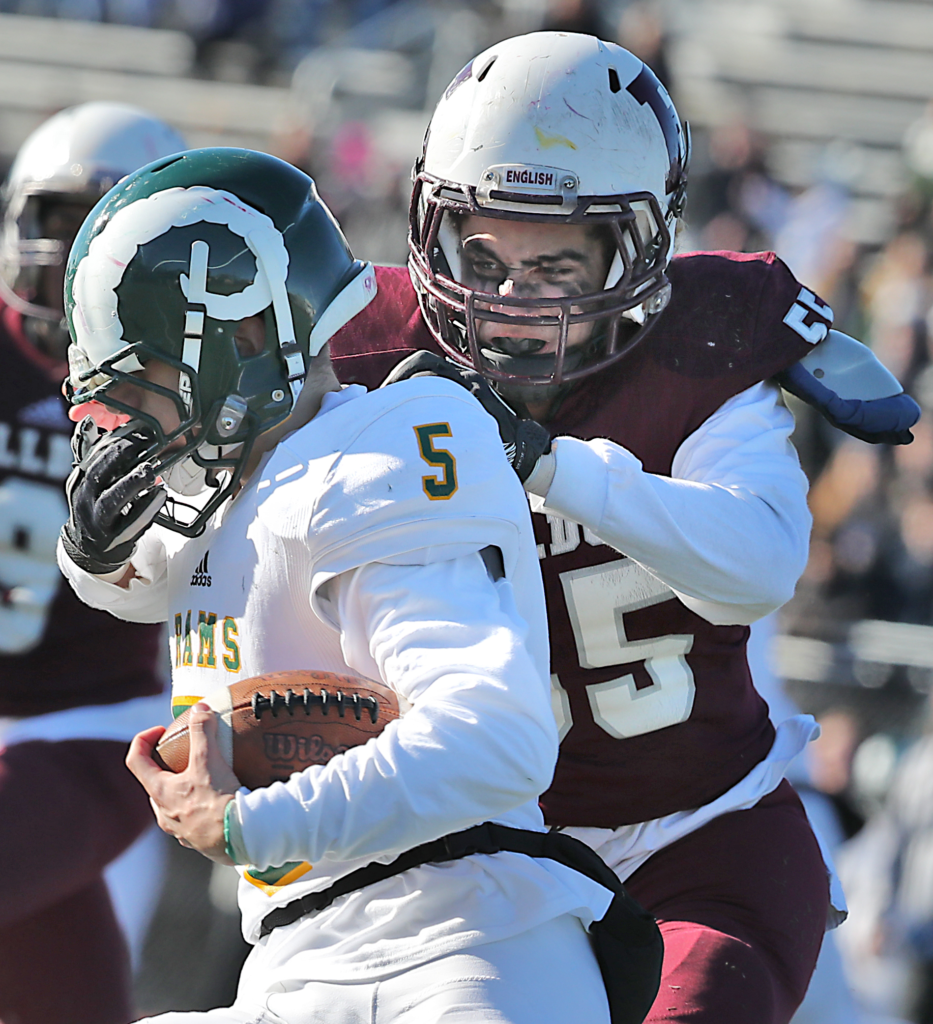 Lynn English’s Mason Jones stopped Lynn Classical’s Marcus Tucker, but got called for the facemasking penalty.