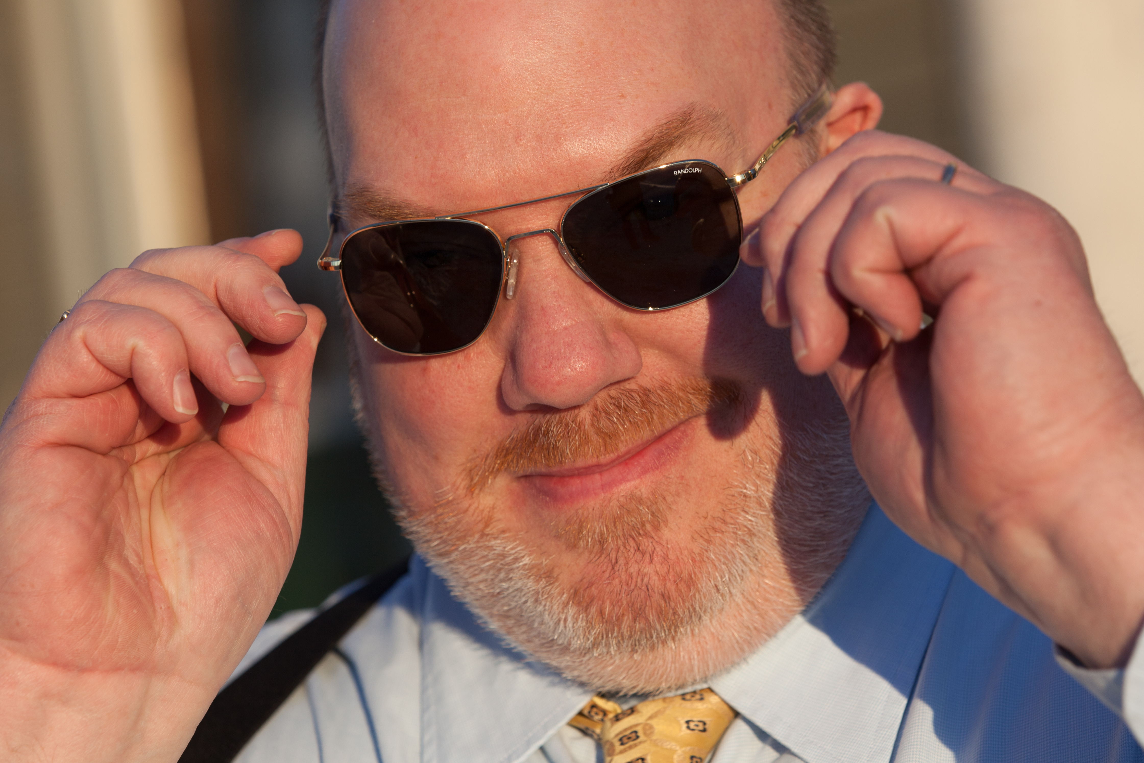 State Sen. Donald Humason Jr. displayed the sunglasses he received as a gift from Sen. Brian Joyce.