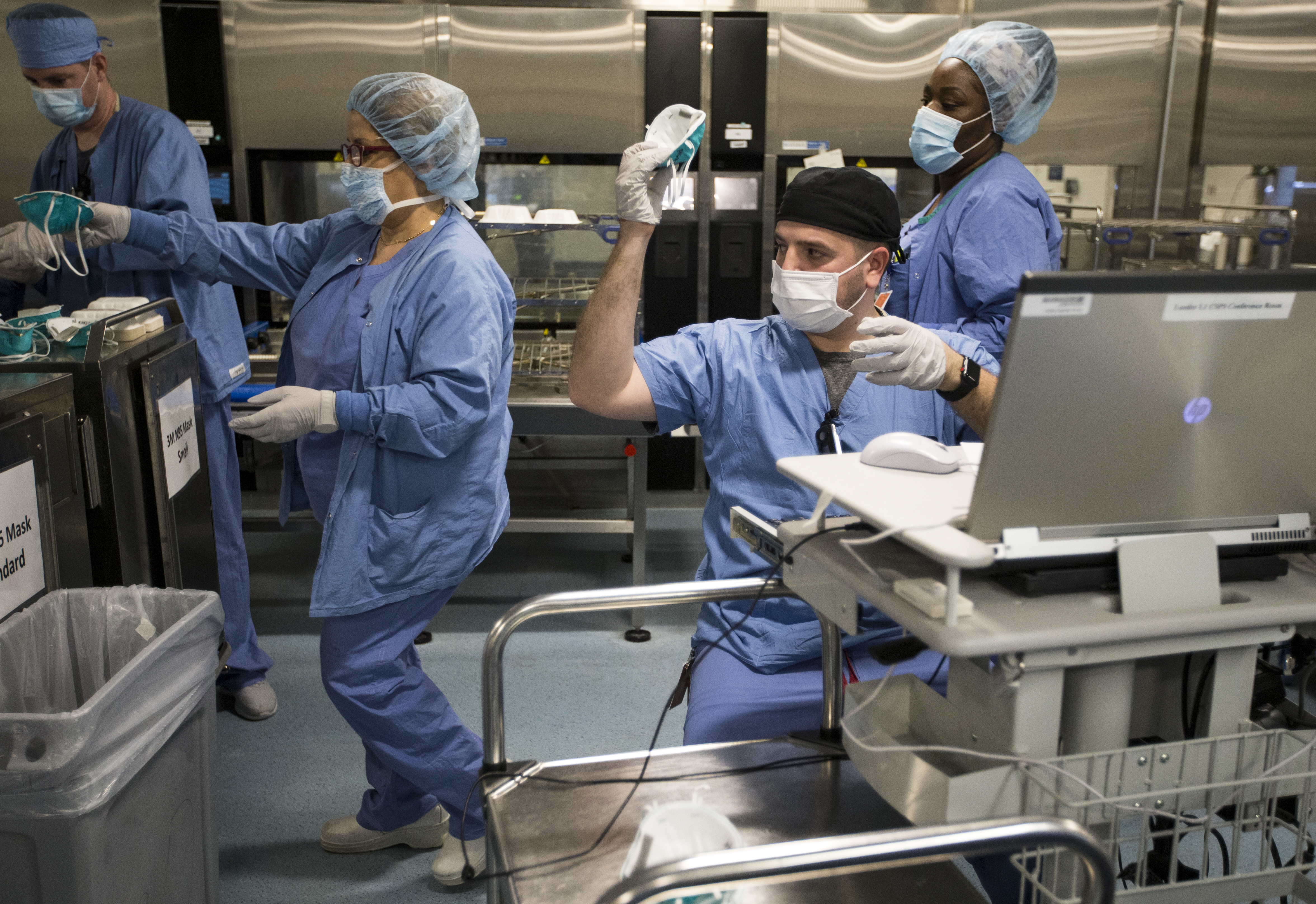 Mark Rosa passed back an N95 mask to be packaged.