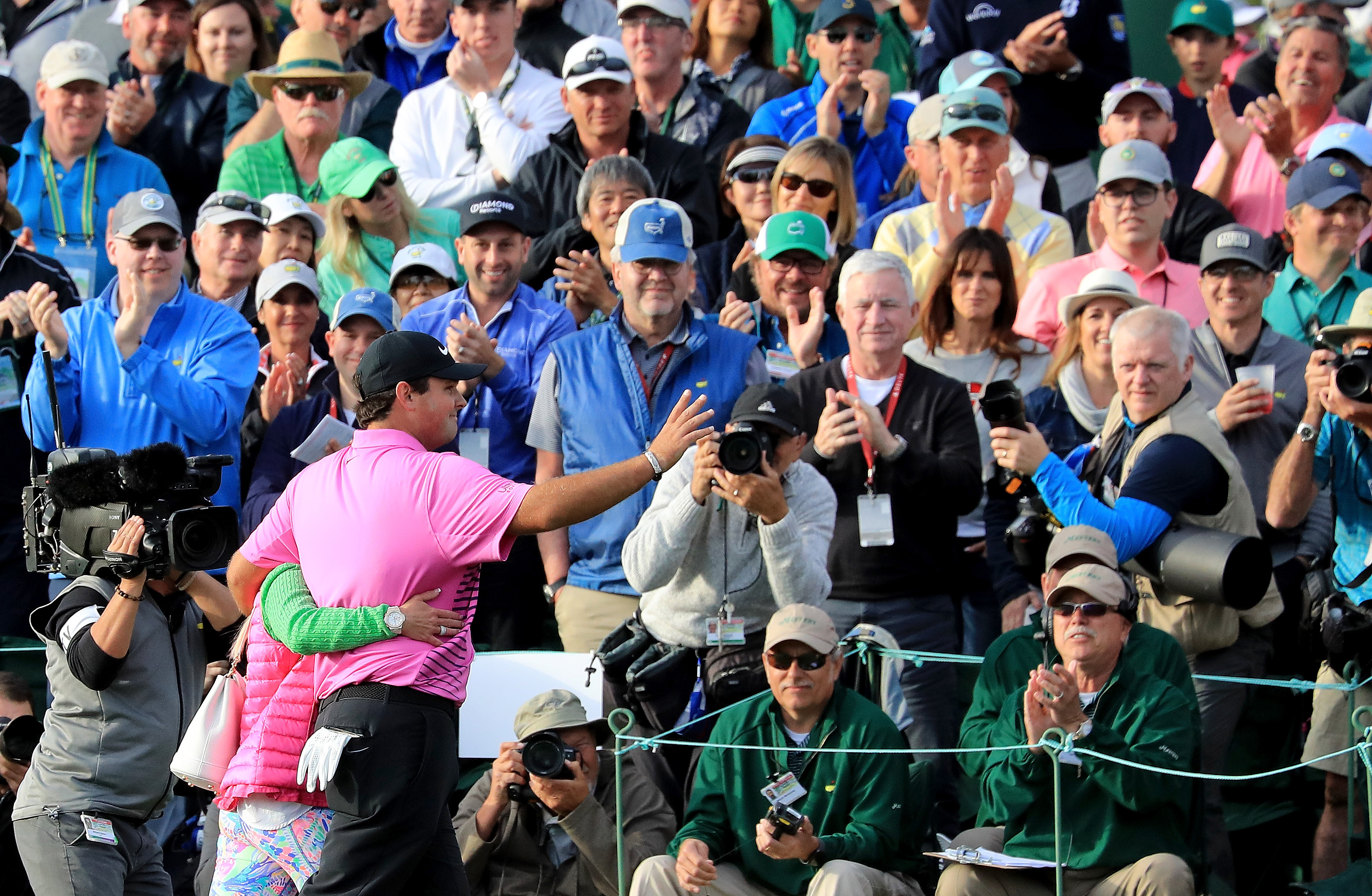 Patrick and Justine Reed walked off the 18th green to cheers.