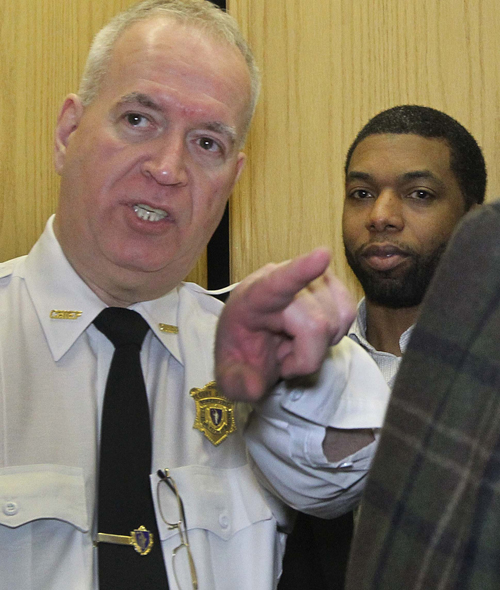 State Representative Carlos Henriquez was escorted to an elevator at the State House after he answered more questions Tuesday from the Ethics Committee.