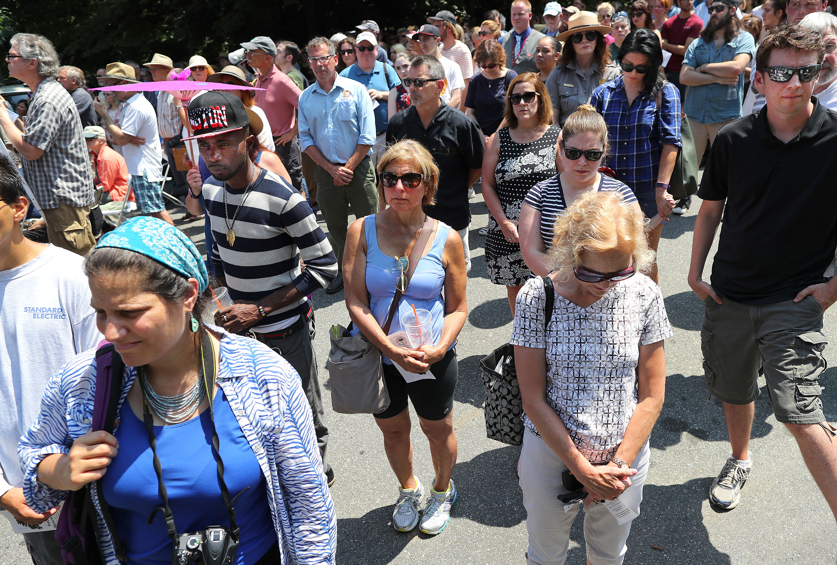 People paused during a prayer at the end of the service.