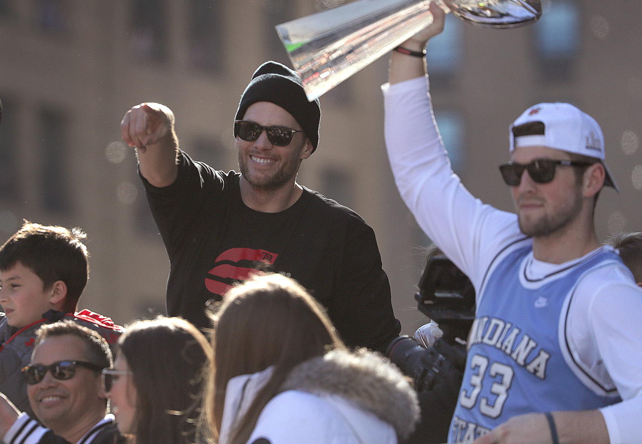 Etling (right) was on the Tom Brady duck boat Tuesday.