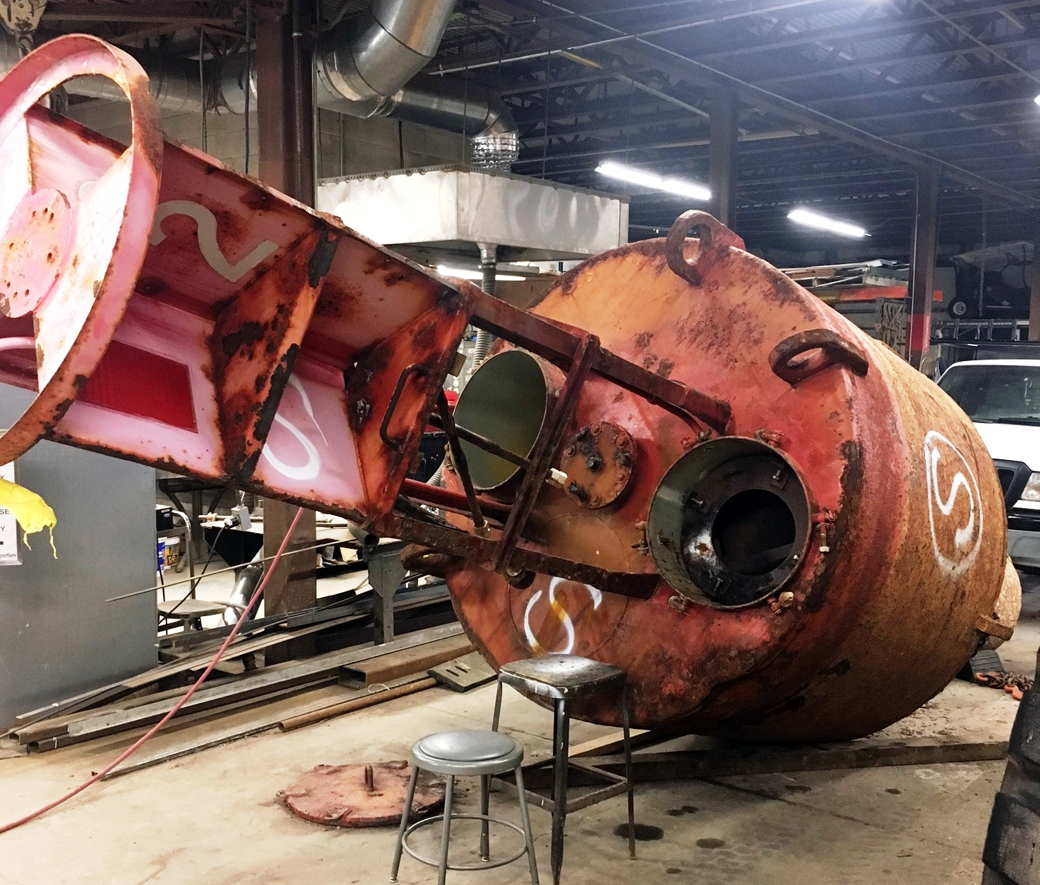The old buoy showed the wear of life at sea before it was refurbished.