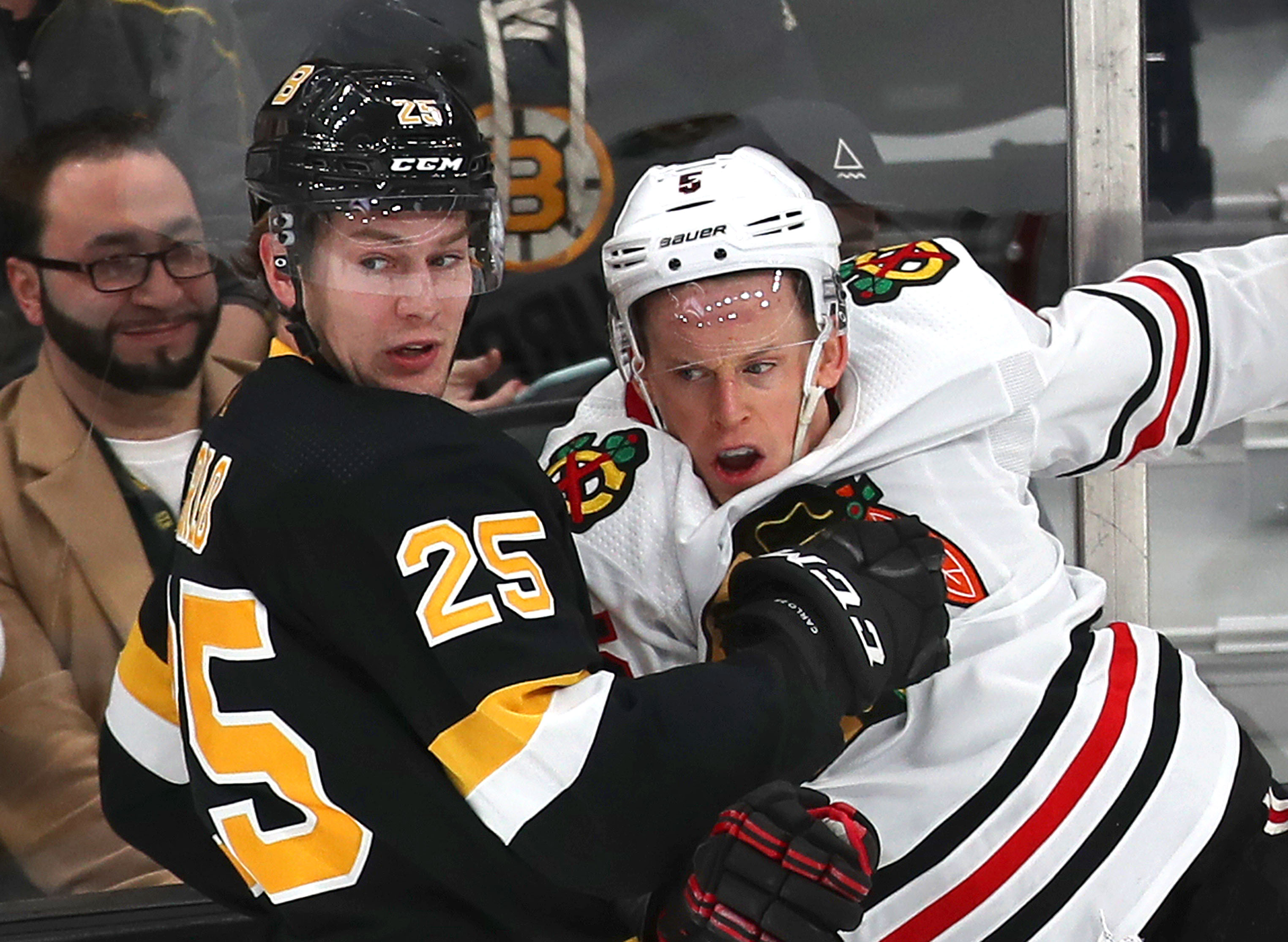 Brandon Carlo (left) is in his fourth season with the Bruins.