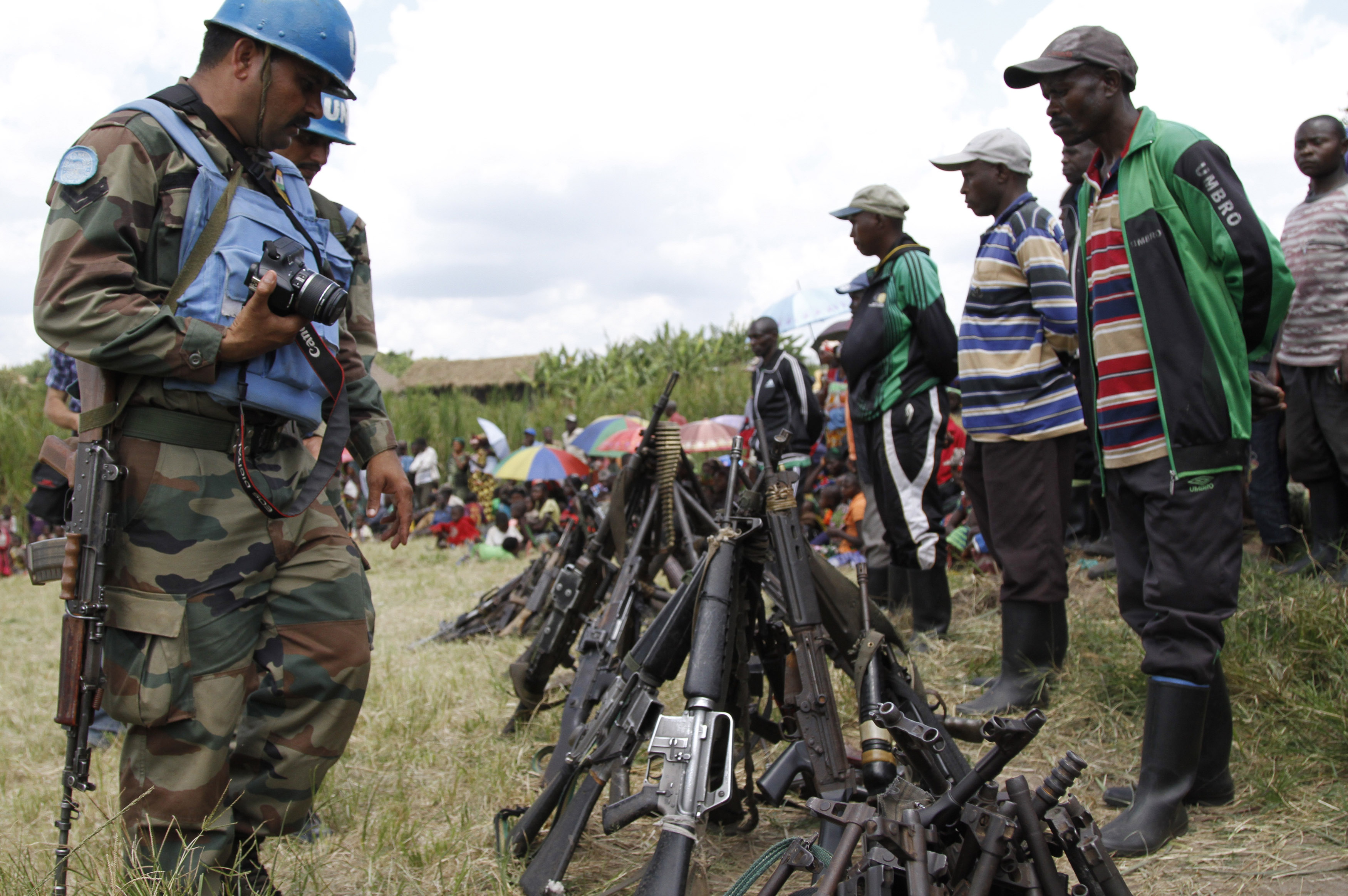 UN peacekeepers with weapons recovered from militants in Congo in May.
