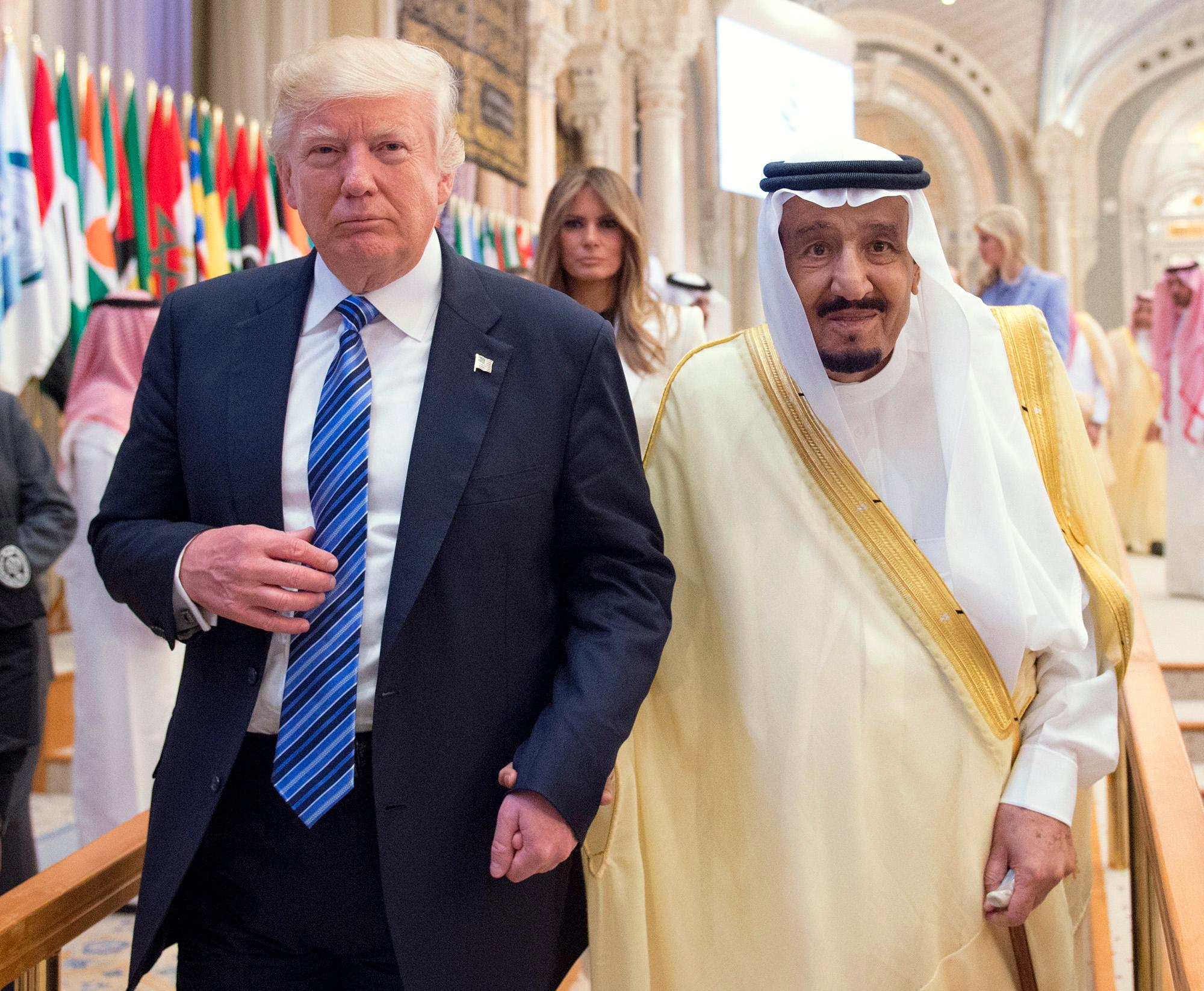 Trump and King Salman bin Abdulaziz al-Saud of Saudi Arabia headed to a meeting with regional leaders Sunday in Riyadh. Melania Trump walked behind them.
