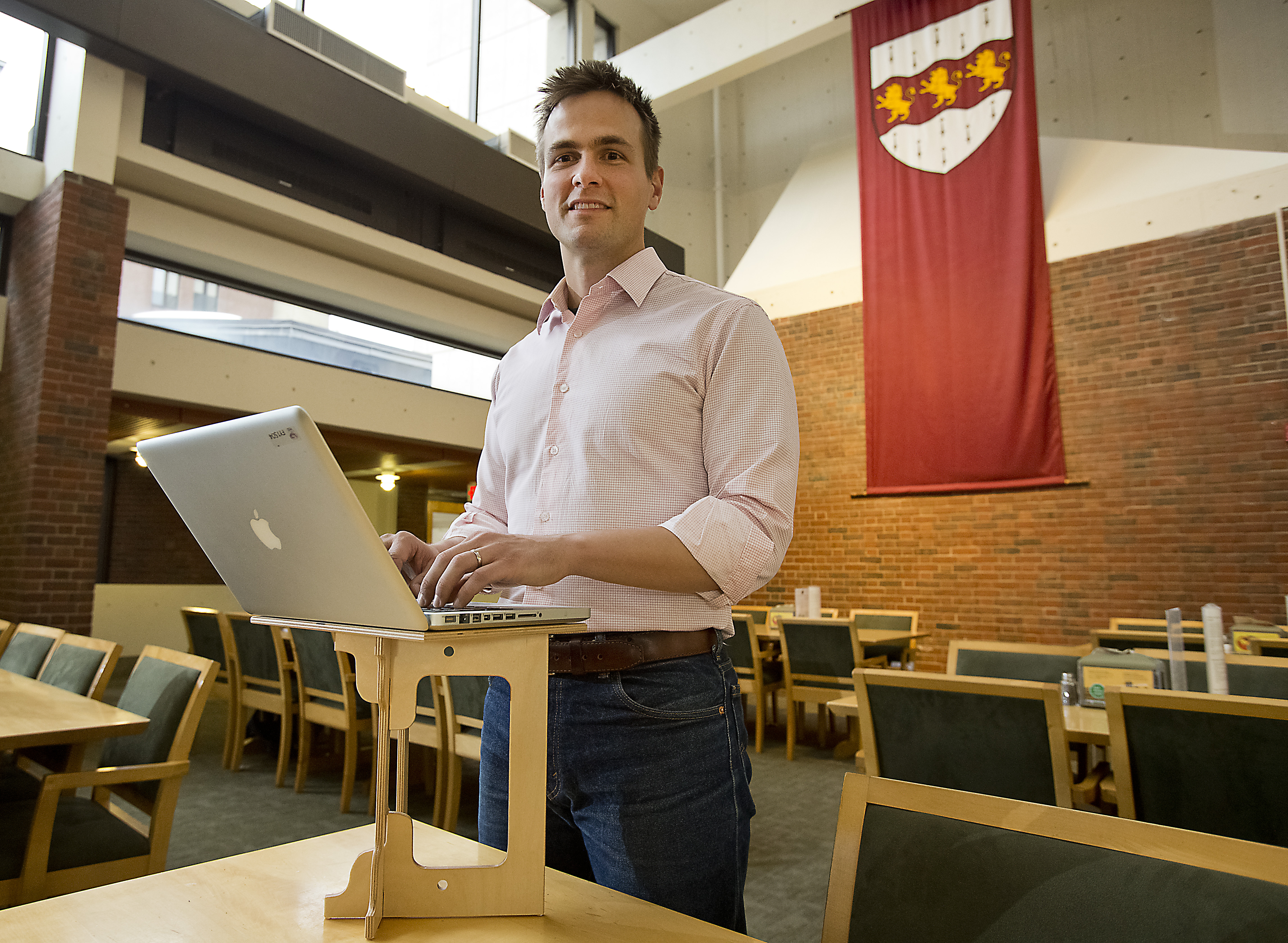 Luke Leafgren and his portable computer stand invention at Harvard.