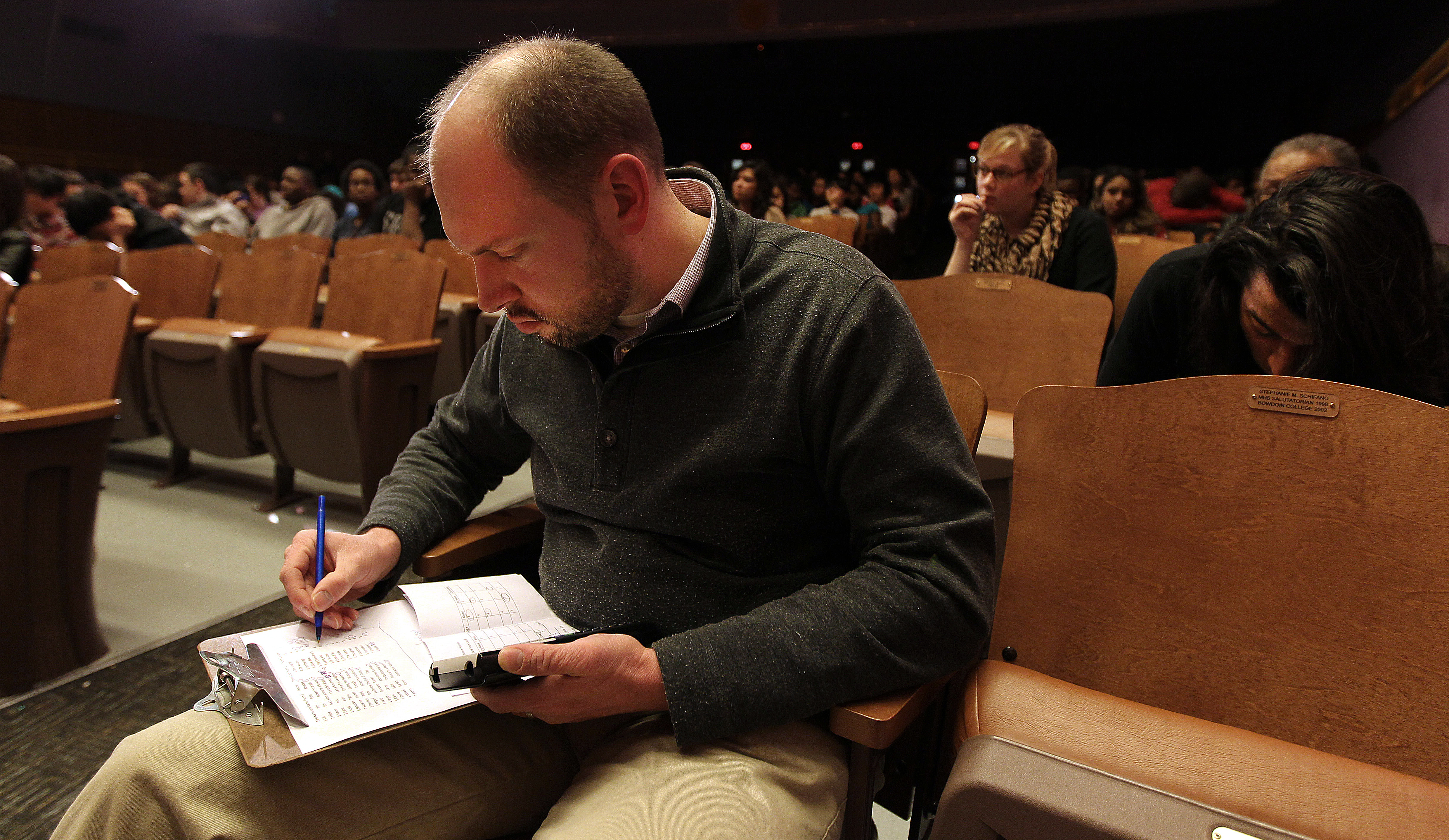 Math teacher Nick Lippman compiles the judges’ scores.