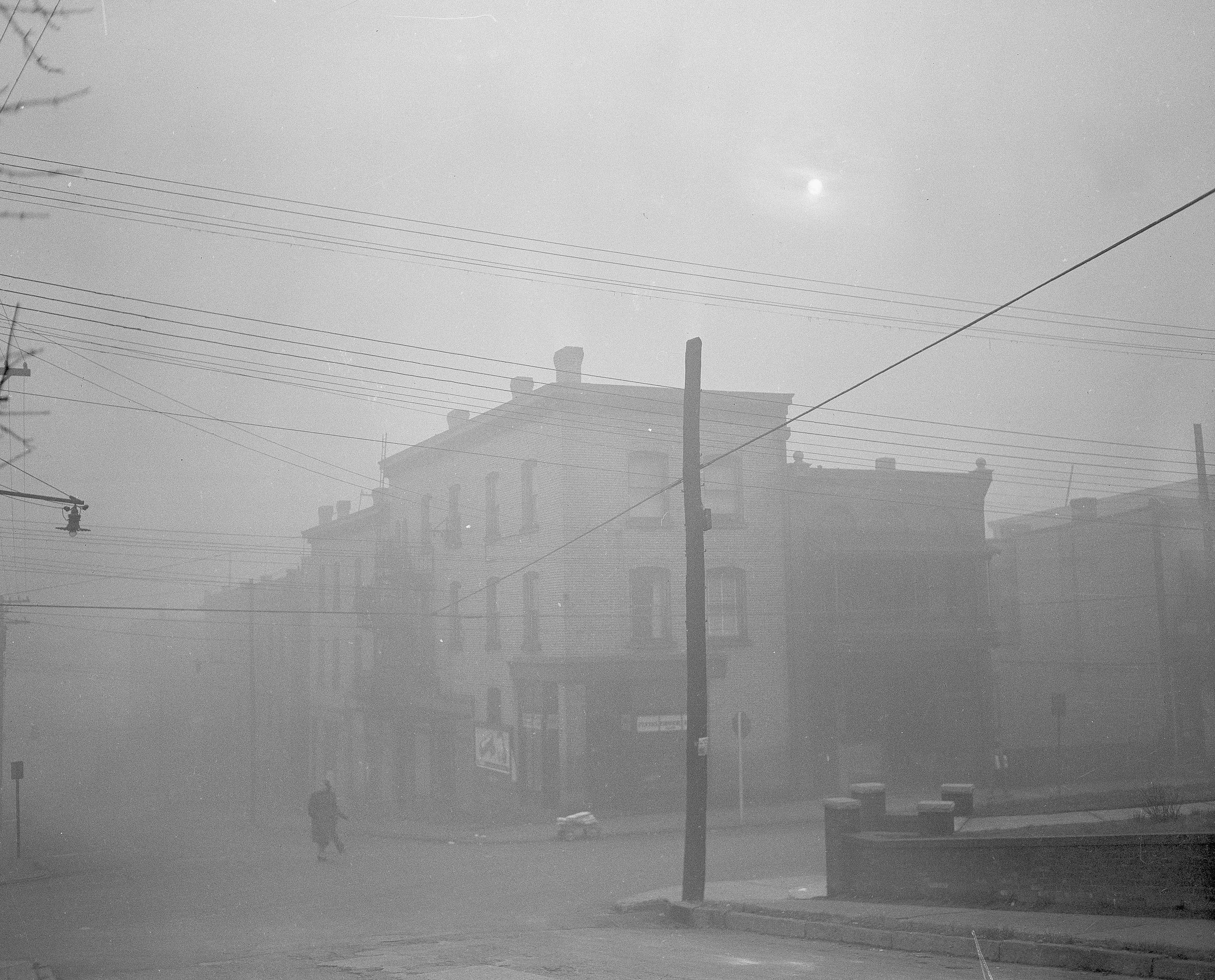 On Oct. 30, 1948, the main business district of Donora, Pa., was cloaked in smog, the sunlight virtually obliterated by thick low-hanging pollution.