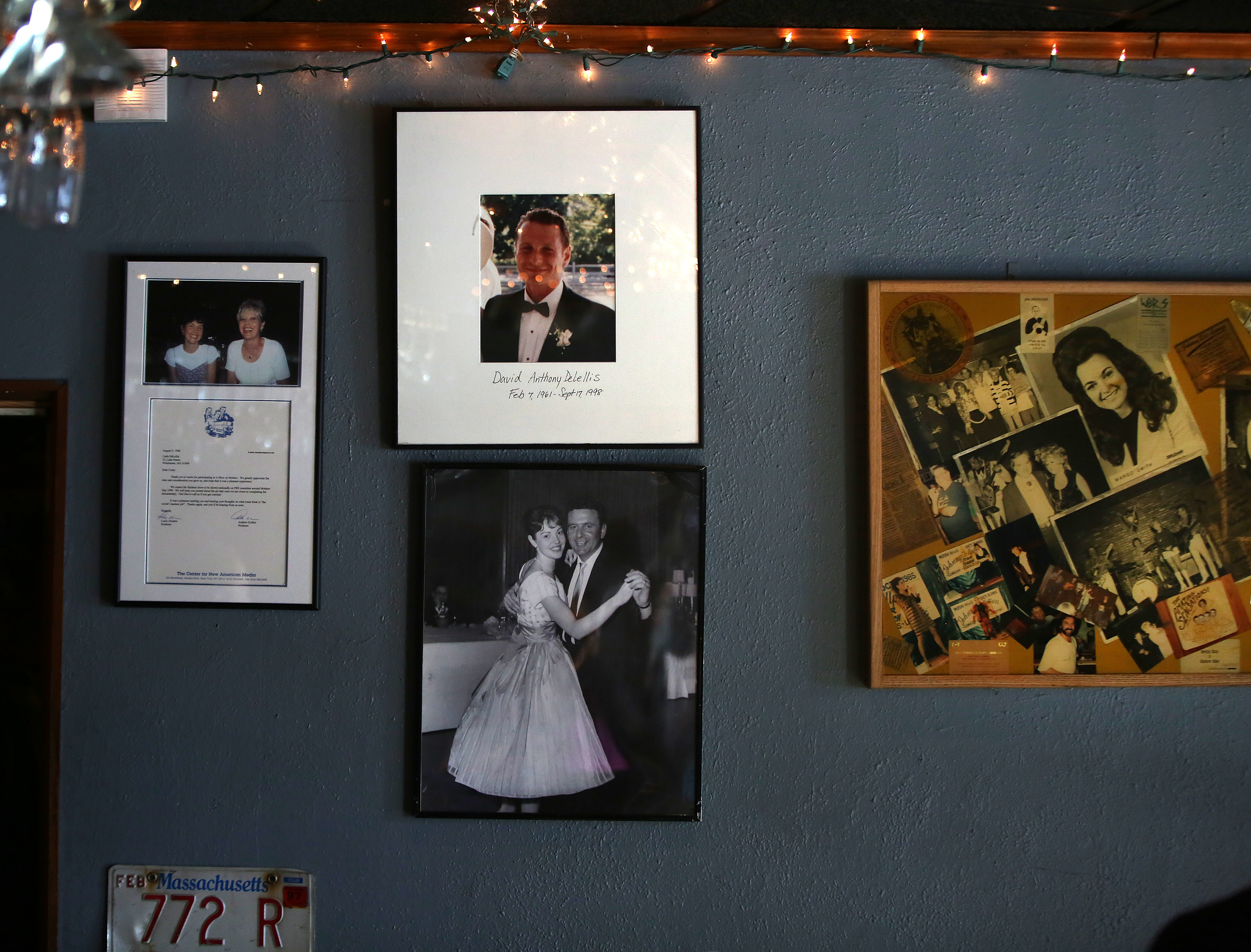 Pictures of the parents and brother of Johnny D’s owner Carla DeLellis adorn a wall of the club.