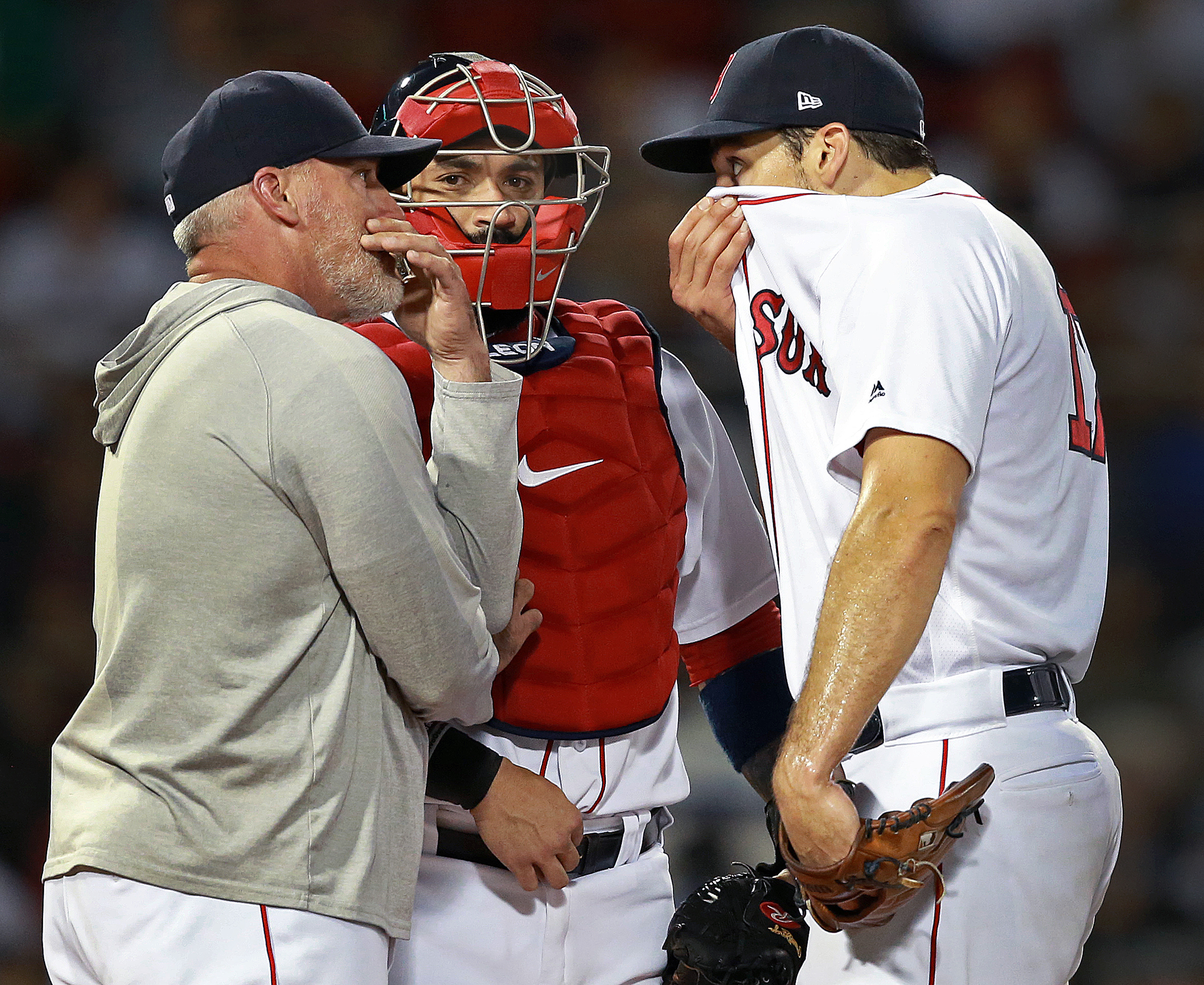Red Sox pitching coach Dana LaVangie (left) had a chat with starting pitcher Nathan Eovaldi on the mound during a game last August.