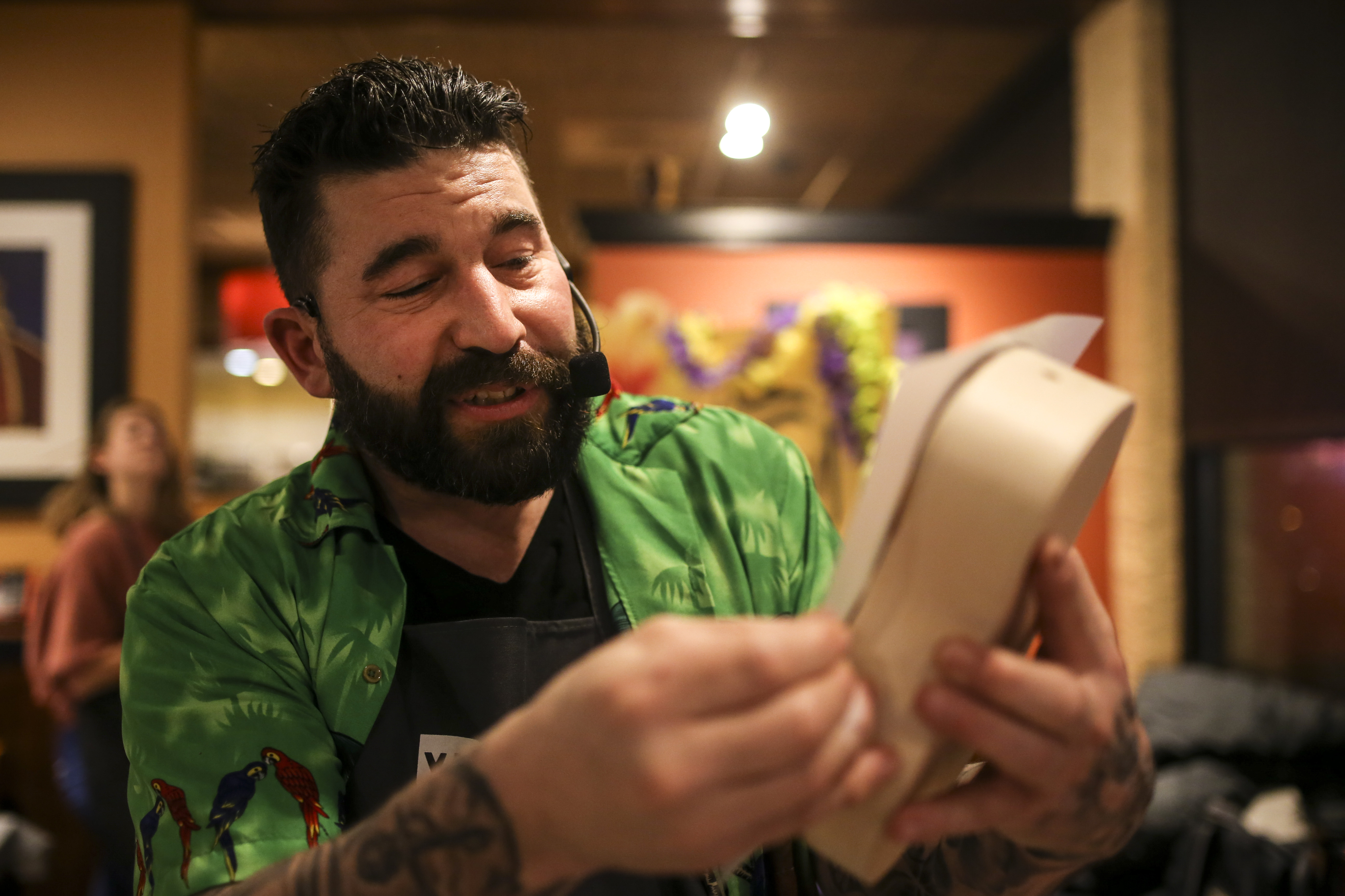 David Daykin demonstrates part of the ukelele building process during a ukulele-building event put on by Yaymaker at Bertucci's Thursday night.